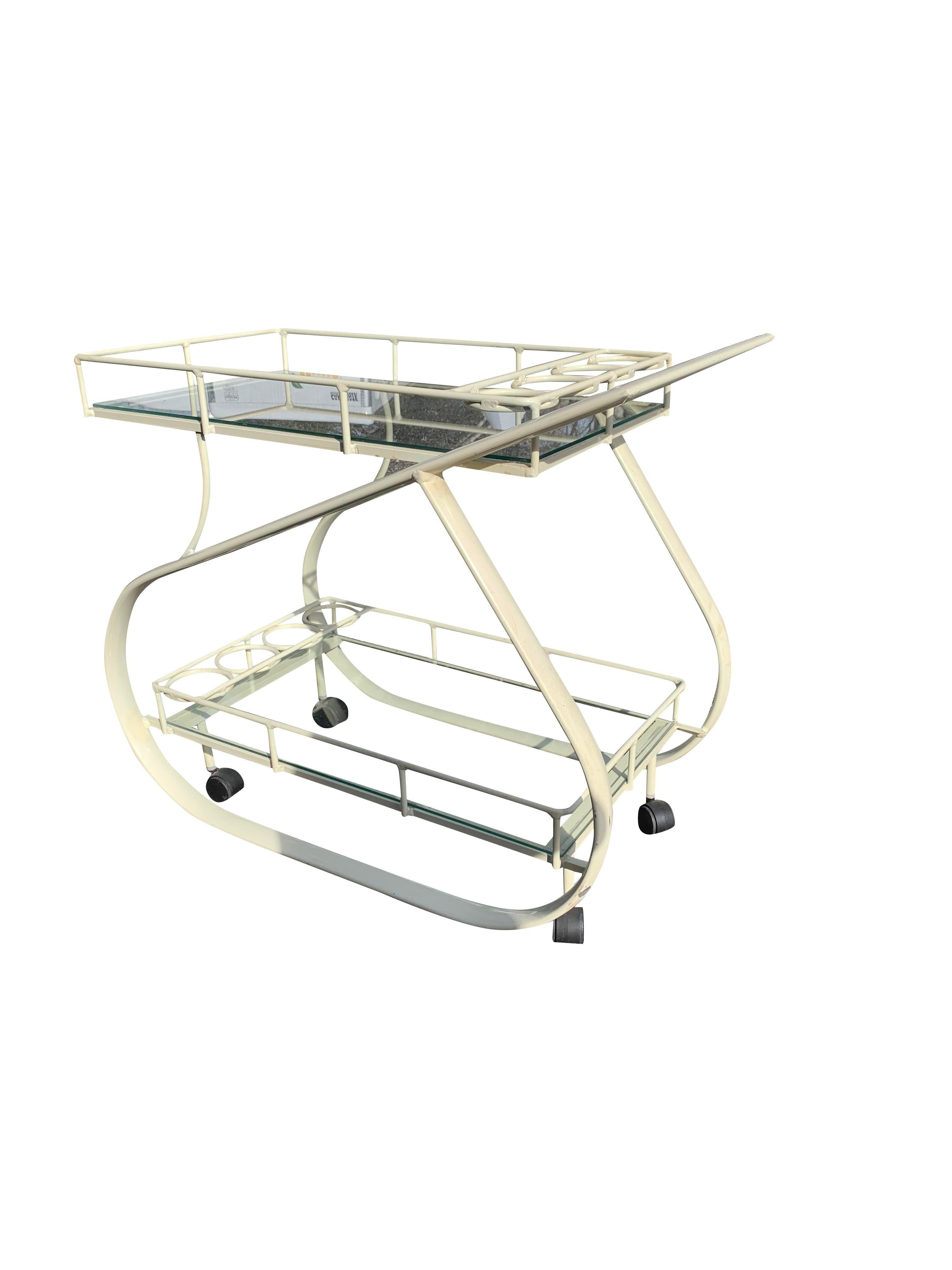 Vintage Postmodern Bar or Tea Serving Cart

This vintage bar or tea serving cart is a must-have for anyone looking to add a touch of retro style and functionality to their home. The unique design and high-quality materials make it a valuable and