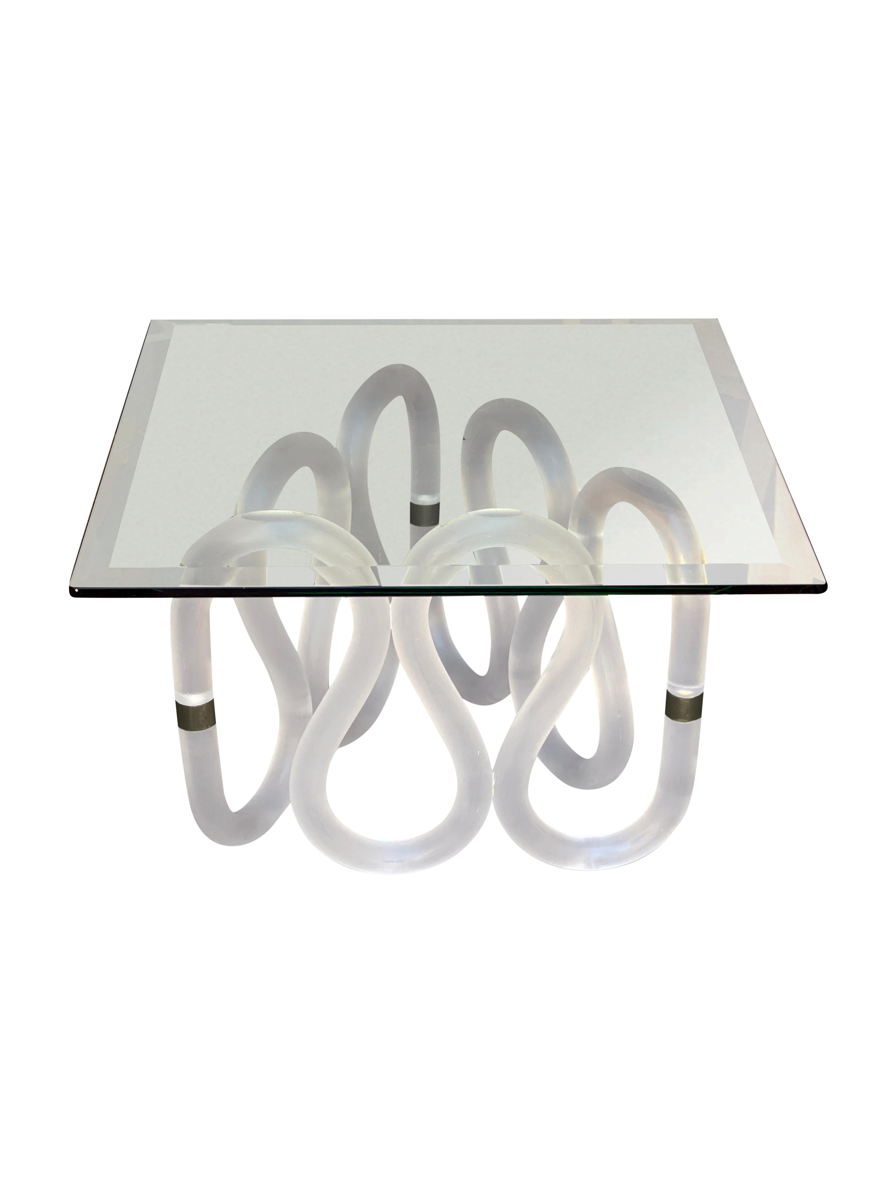 A rare, beautiful post modern glass-top coffee or side table with frosted lucite and bronze-finished caps. Glass is in excellent condition, and so is Frost with some minor etching marks throughout. A beautiful and unique sculptural lucite table