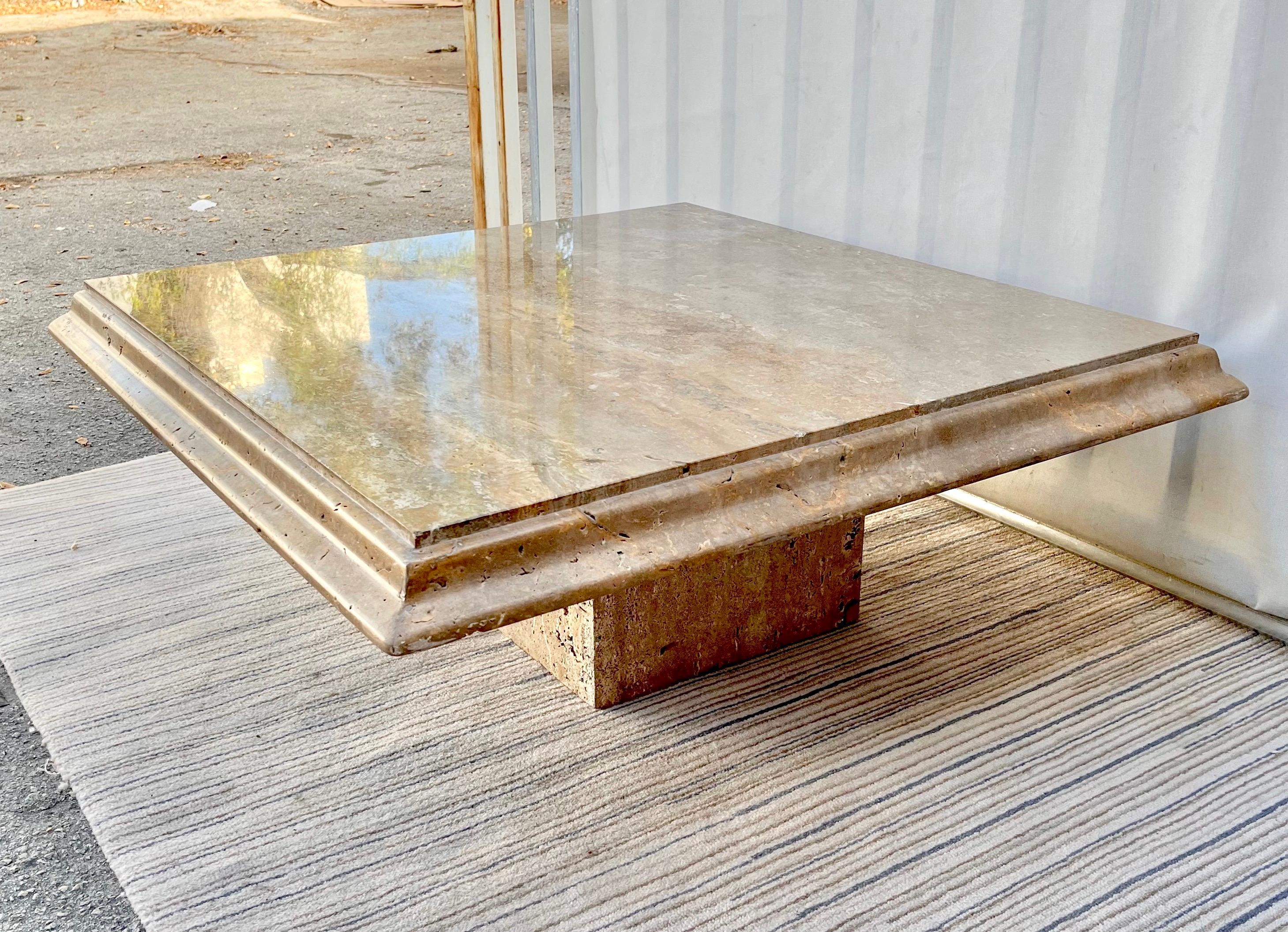 Vintage Postmodern Italian Travertine coffee table by Stone Intentional Italy. Circa 1980s.
Features a nicely curved border at edges and a gorgeous natural grain.
Top removes for easy transportation.
In very good original condition with minor