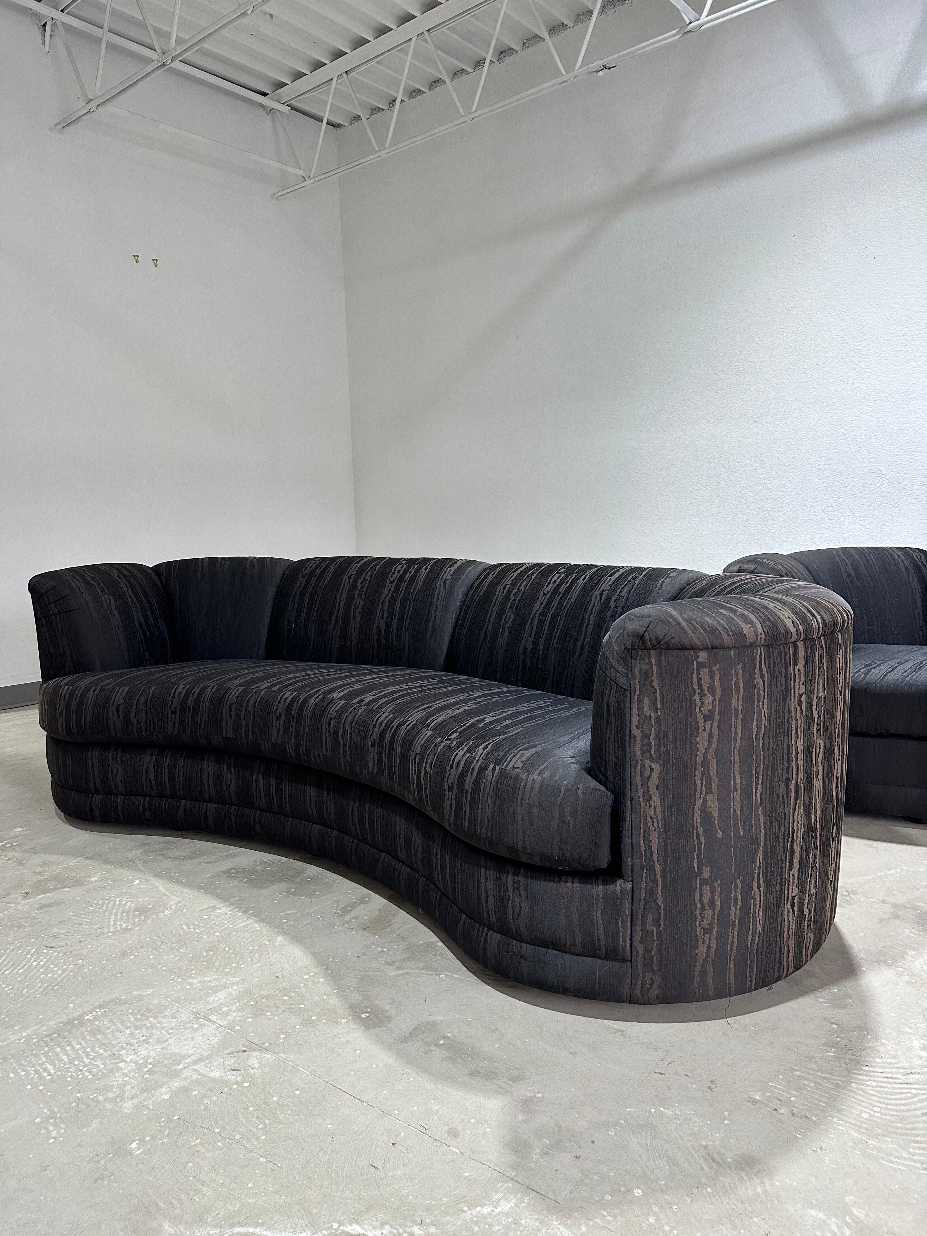 Vintage Postmodern Curved Kidney Bean Shaped Sofa in black Miore pattern fabric with channel tufted back c.1980’s. In the style of Vladimir Kagan.

Beautiful post mod sofa with subtle curved shape upholstered in black moire watermark faux silk
