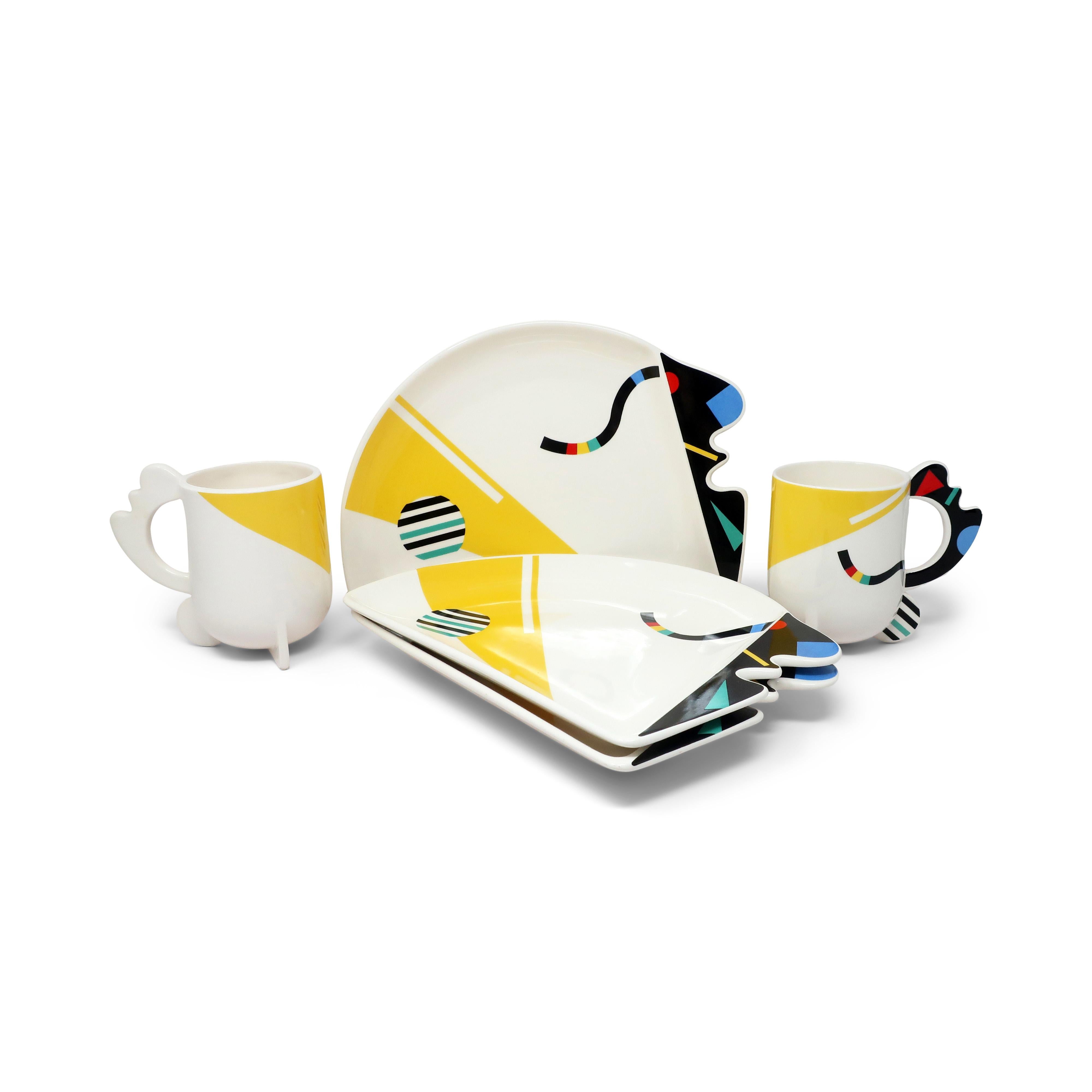 A set of 2 mugs and 3 plates in the Humoresque pattern for Kato Kogei's Fujimori Collection.  Fujimori was born in Japan in 1935 and won the National Art Award when he was just 19.  He later worked in Chicago as a ceramics designer before returning