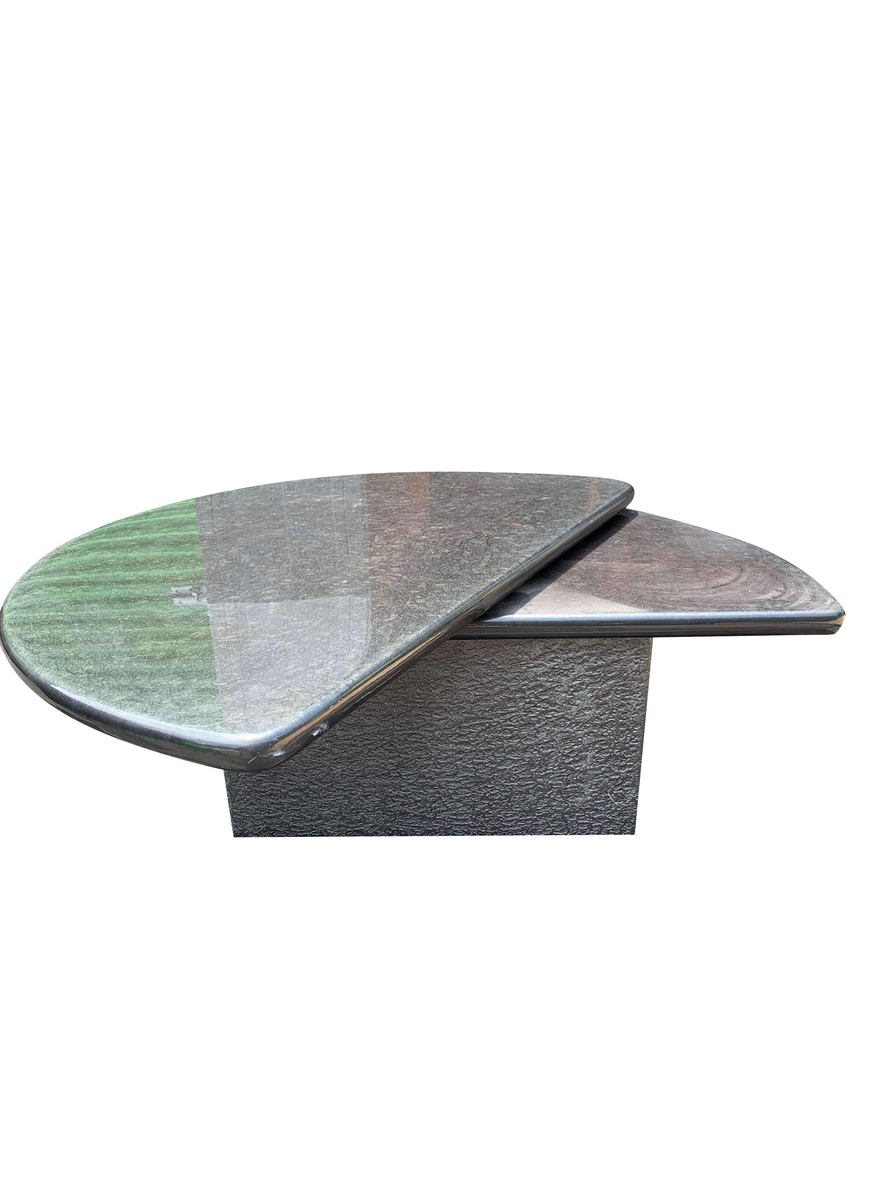 Vintage Post Modern Lacquered Half Moon Rotating Coffee Table

This vintage coffee table is a must-have for anyone looking to add a touch of contemporary style to their home. The unique design and functional features make it a versatile and stylish