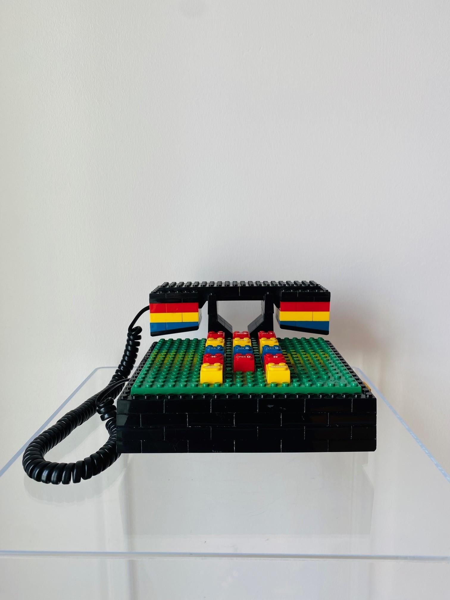 Incredible vintage Lego telephone by Tycho.  Original piece from the 1980s with striking yet endearing presence.  The nostalgic elements come thru in this piece catapulting it to a sculptural rendering of design history.  The molded, perfectly blunt