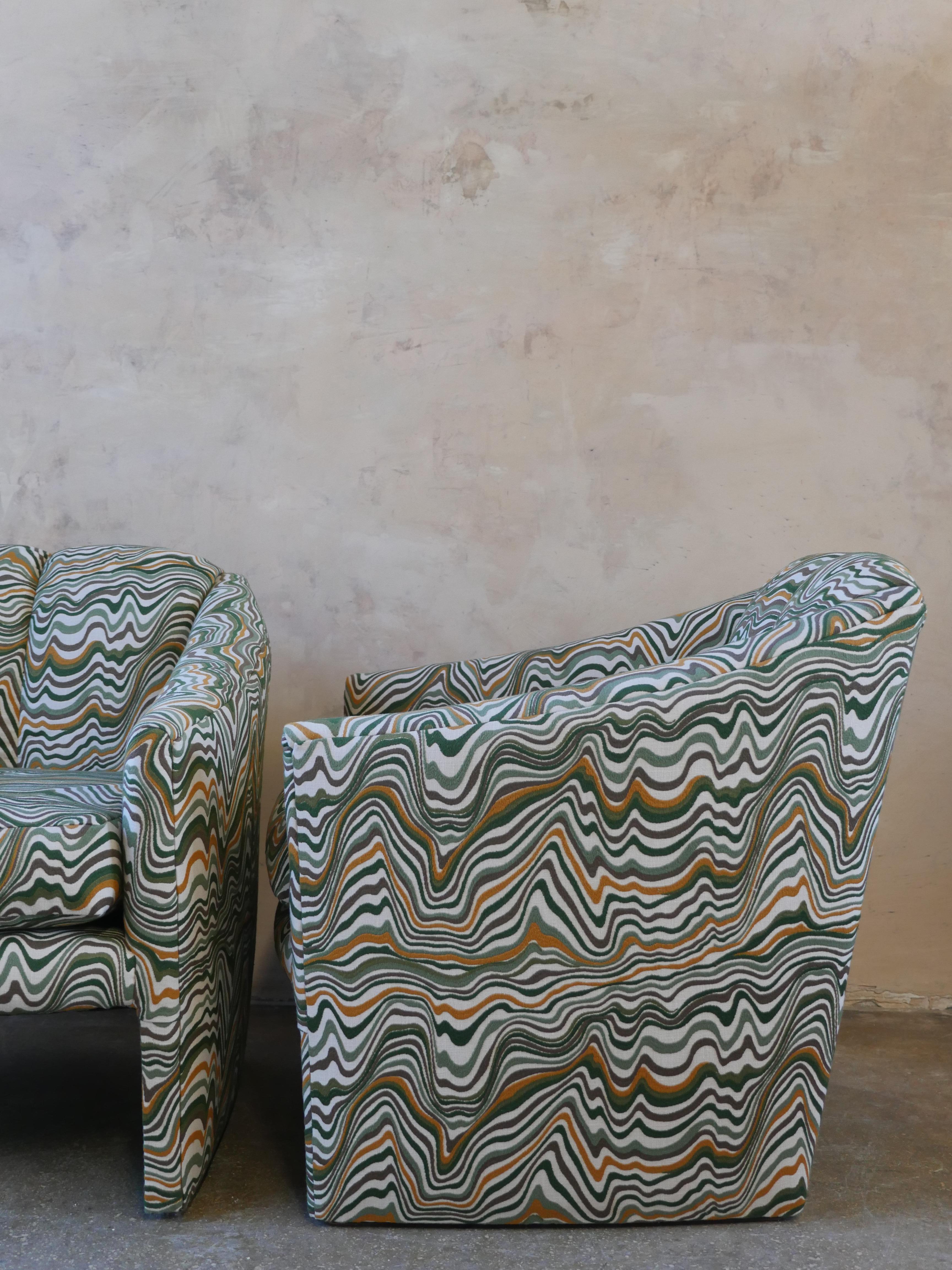 Vintage 1980s, pair of postmodern lounge chairs, reupholstered in a beautifully stitched linen fabric. The varying earth tone colors of the fabric add a unique and cool vibe to any space.