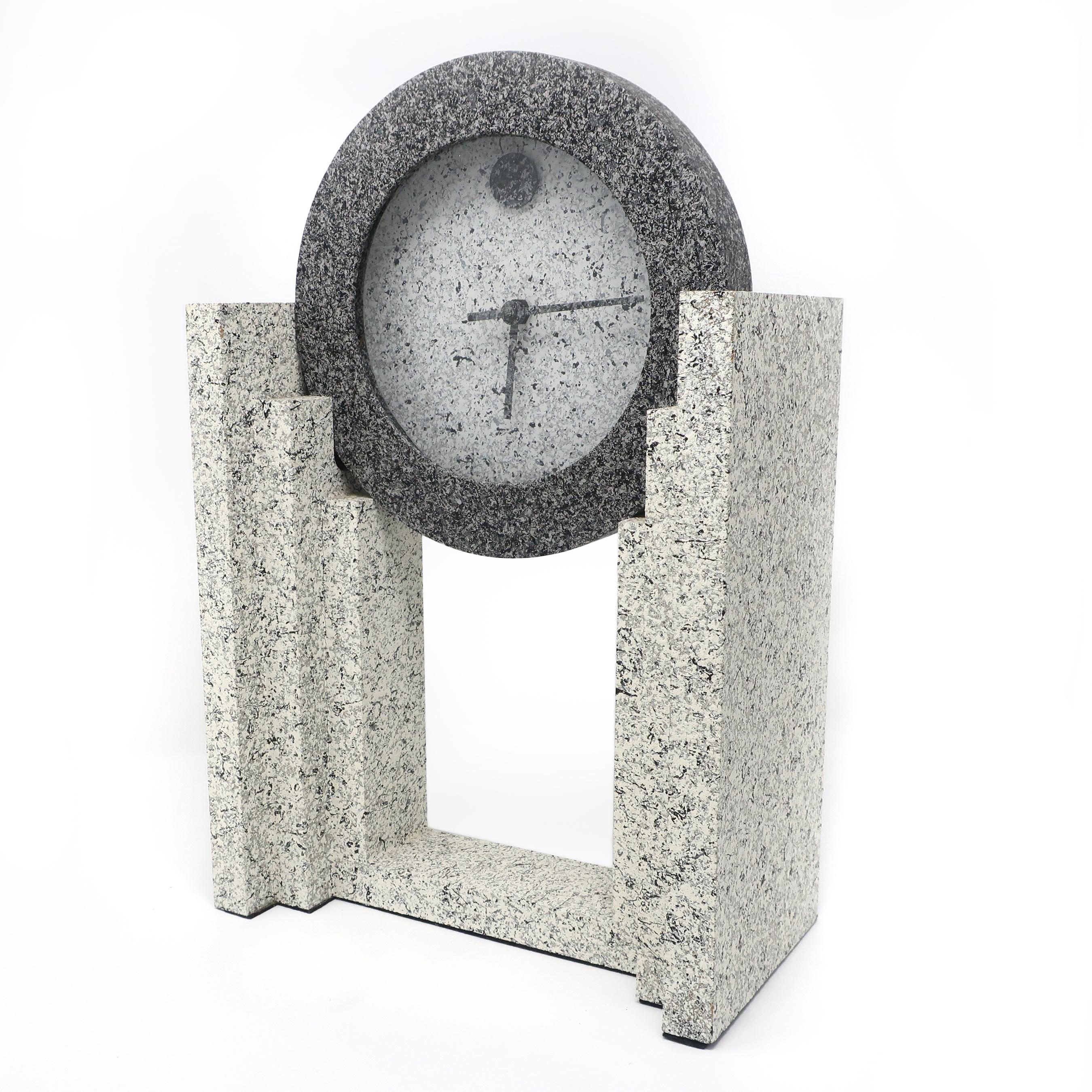 A vintage 1980s postmodern textured mantle clock by Empire Art Products in various shades of spelled gray. In very good vintage condition and works well.

Measures: 9.5