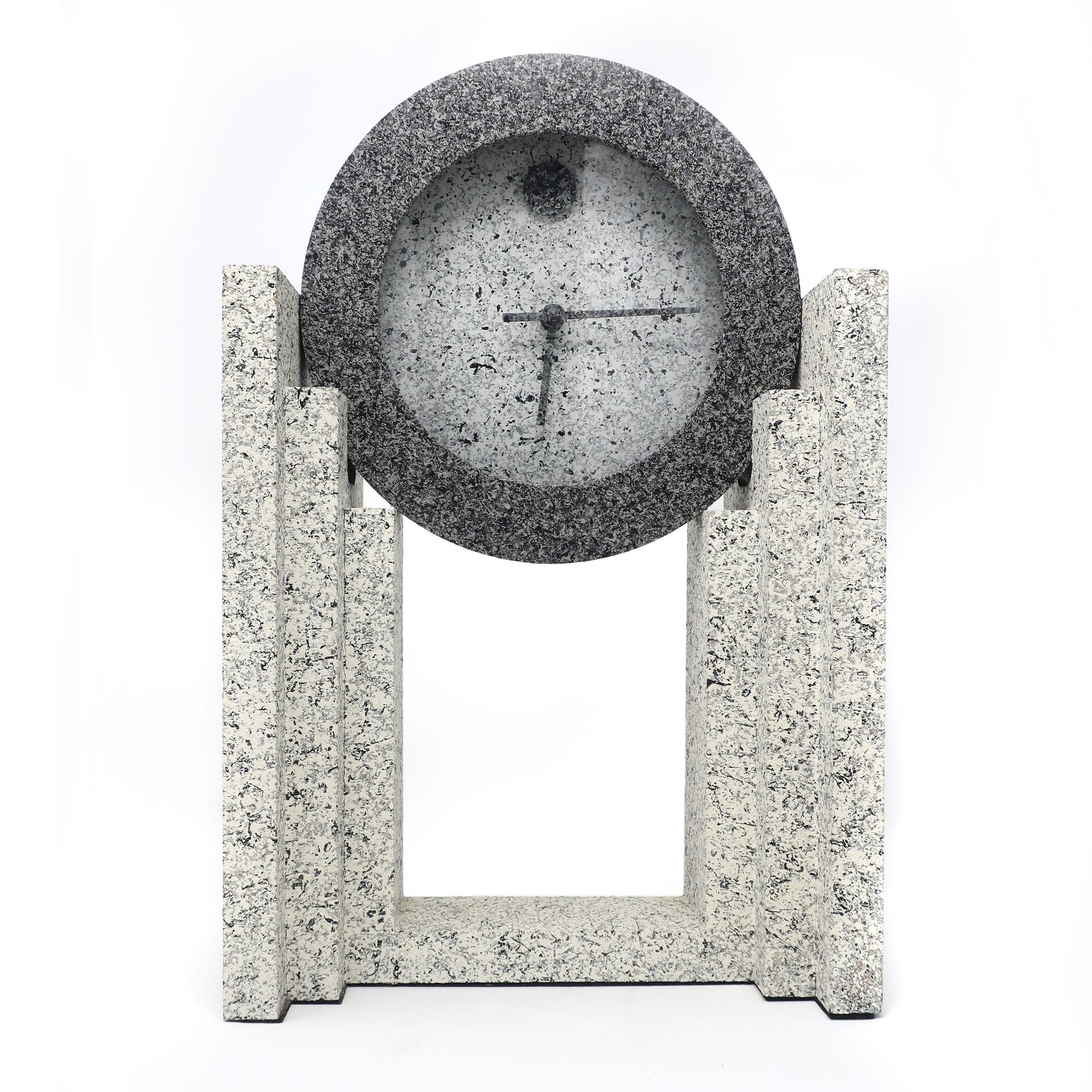 A vintage 1980s postmodern textured mantle clock by Empire Art Products in various shades of spelled gray. In very good vintage condition and works well.

Measures: 9.5