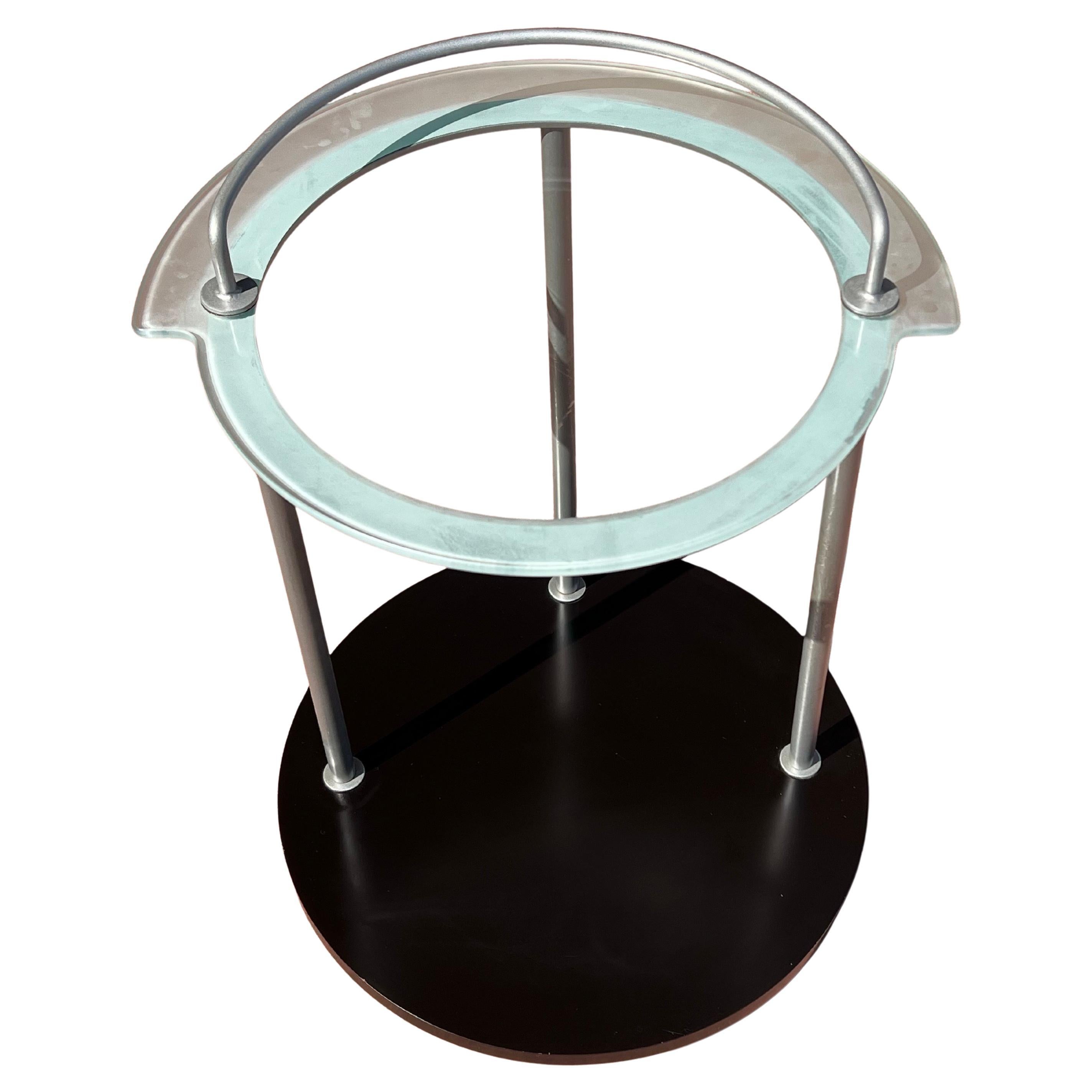 Very unique rolling bar cart circa 1980's Art Deco Memphis Era Style circa 1980's black laminated bottom with glass top , with frosted edge and metal powder coated finish frame. Made in Italy very clean condition. sitting on 4 small casters with