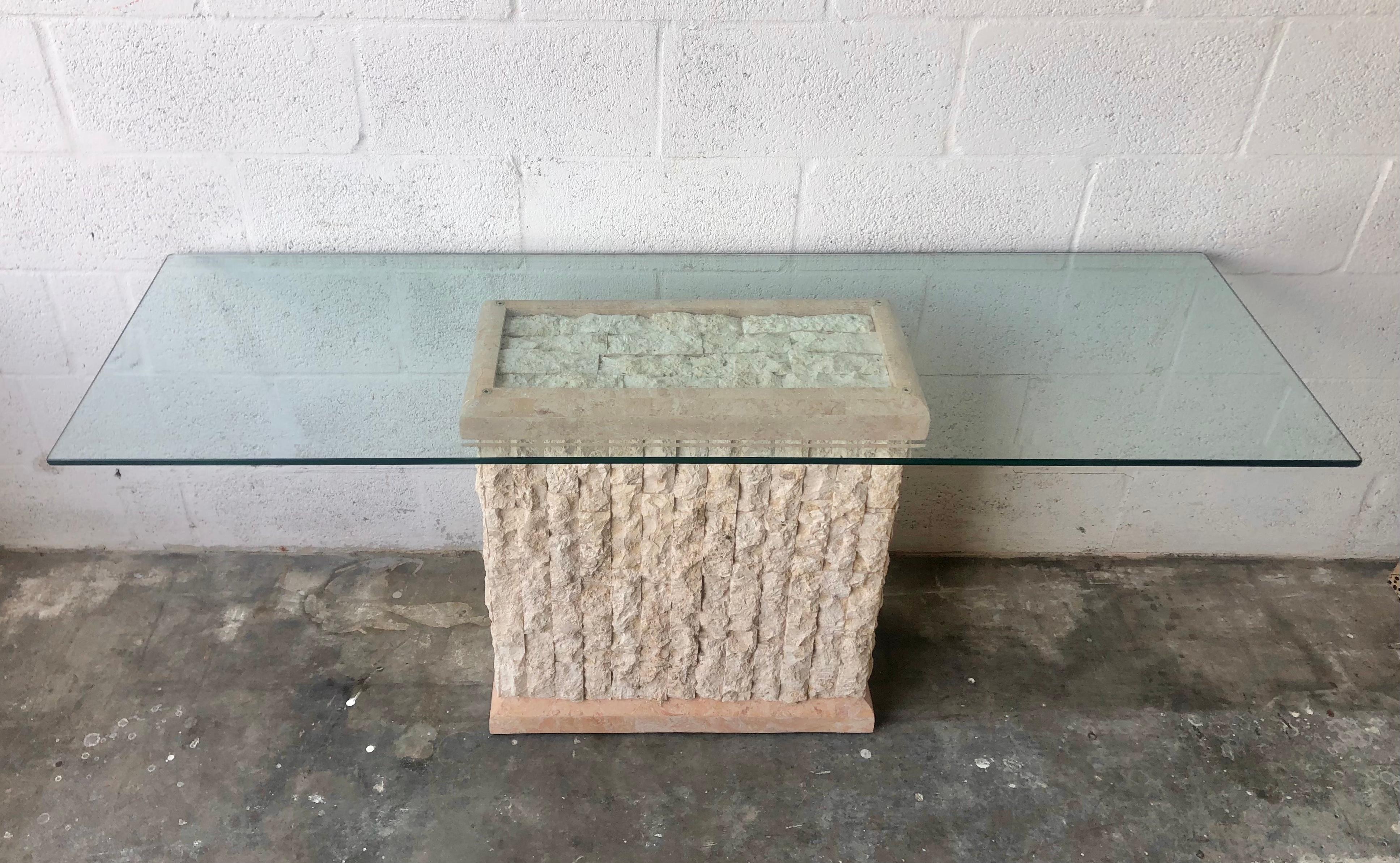 Vintage Postmodern Natural Mactan Stone Console /Sofa Table. Circa 1980s 
Features a rectangle beveled 1/2 thick glass top resting on a fractured Mactan Stone facade pedestal with faux pink marble trims. 
Although this piece looks heavy and