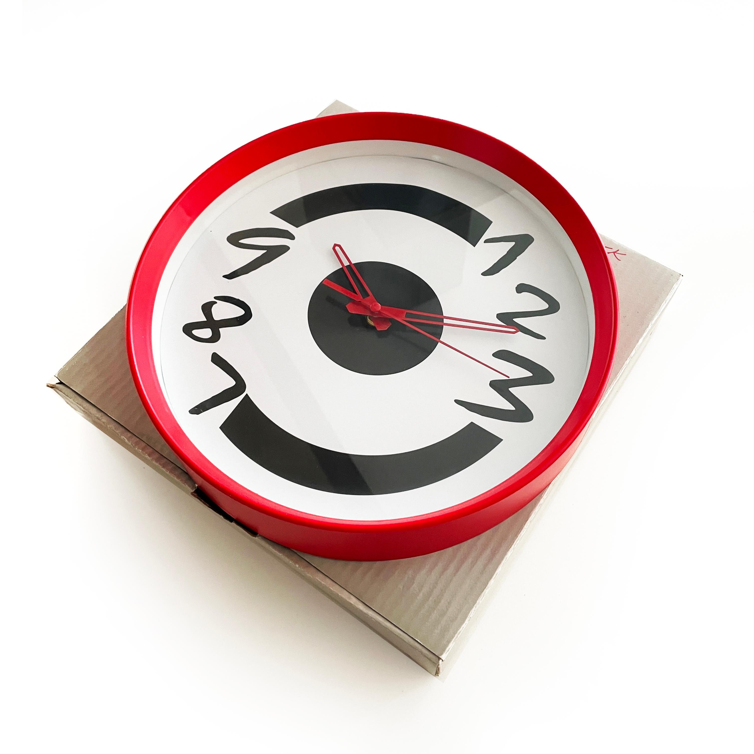 A super fun new old stock 1980s or 1990s clock. Red case, white face with stylized black numbers, and red hands. In very good vintage and unused condition in original box. Takes a single AA battery.

12” x 12” x 3”