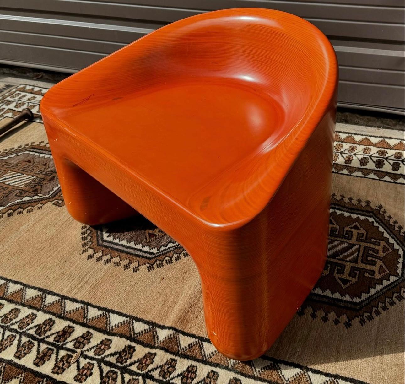 This chair is absolutely stunning! It's made of many layers of oak pressed together and sculpted! 
It's very solid heavy and comfortable! 
Some minor scratches and one what looks to be a marker mark on the seat as seen. 