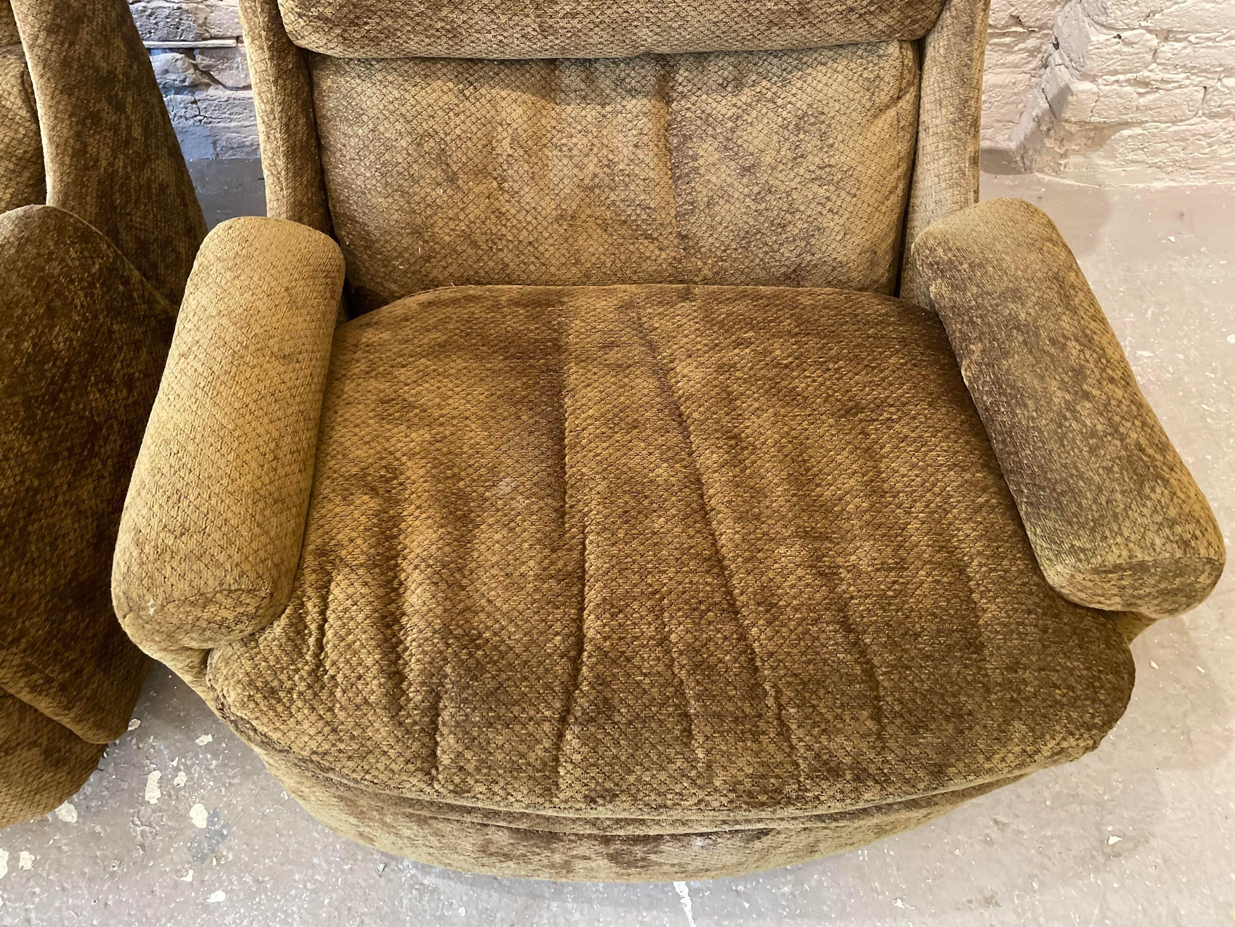 These chairs are incredible. Very heavy with a wooden swivel base in excellent condition. Use as is or redo in glue favorite fabric. 

DIMENSIONS: 32ʺW × 32ʺD × 31ʺH  
STYLES: Modern  
NUMBER OF SEATS: 2  
SEAT HEIGHT: 17.0 in  
PERIOD: 1970s 
