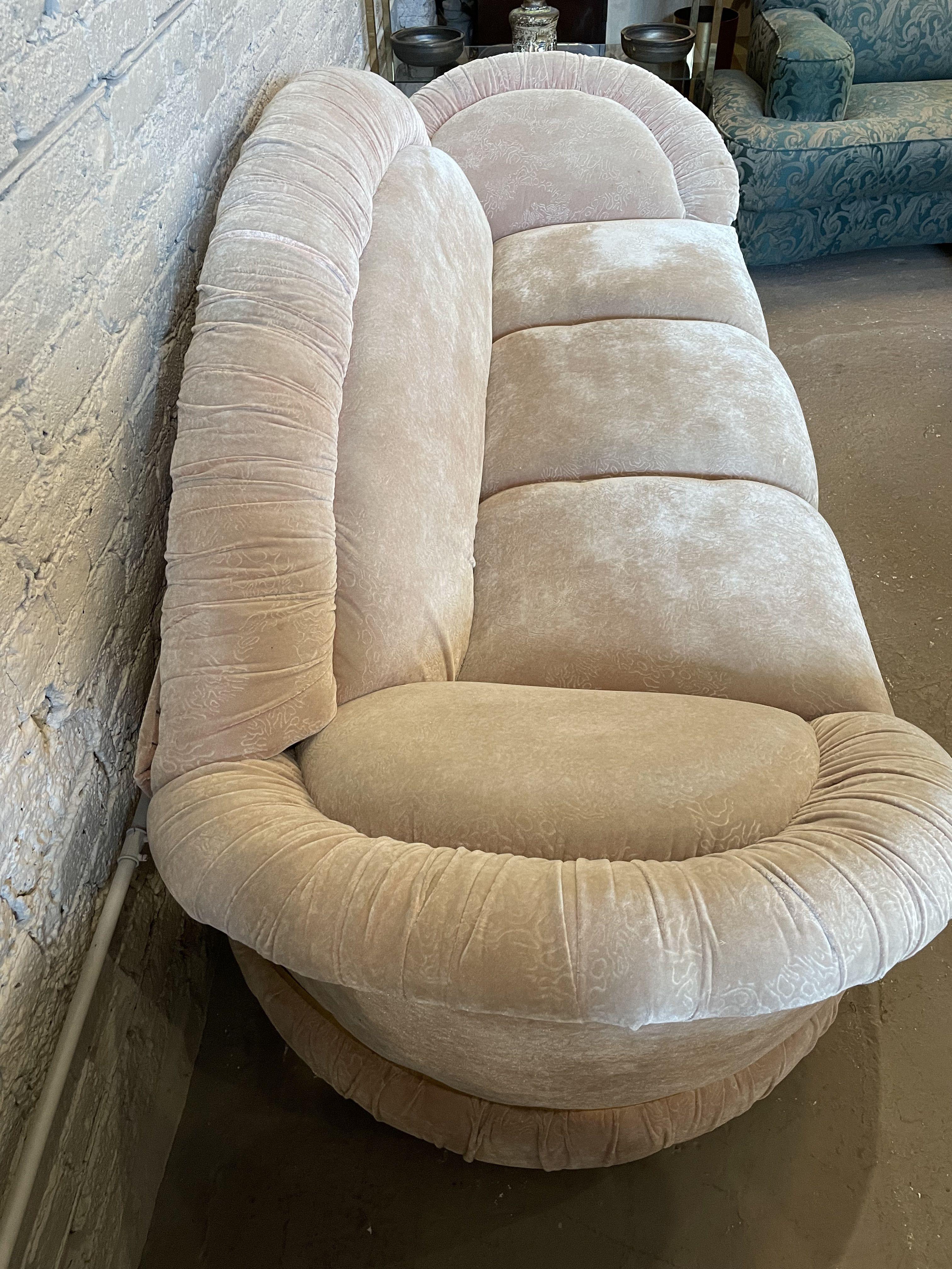 Beautiful and fun sofa set from the 1980s with a brass detailing band. The soft pink fabric with scalloped curves is comfortable to sit on or take a nap (the arms are great pillows!). There are no tears/stains on the original fabric.

Sofa