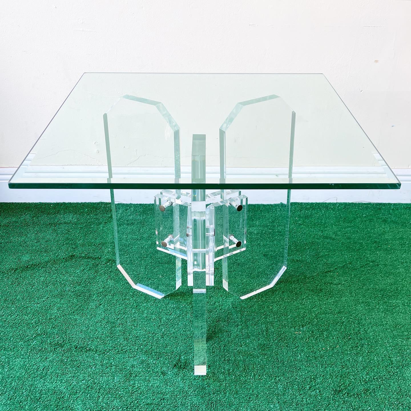 Incredible square glass top side table. Three elongated octagons lock together to make the pedestal.
 