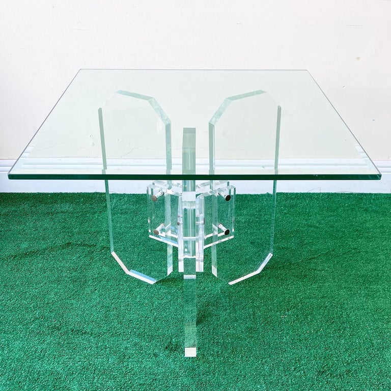 Incredible square glass top side table. Three elongated octagons lock together to make the pedestal.
 