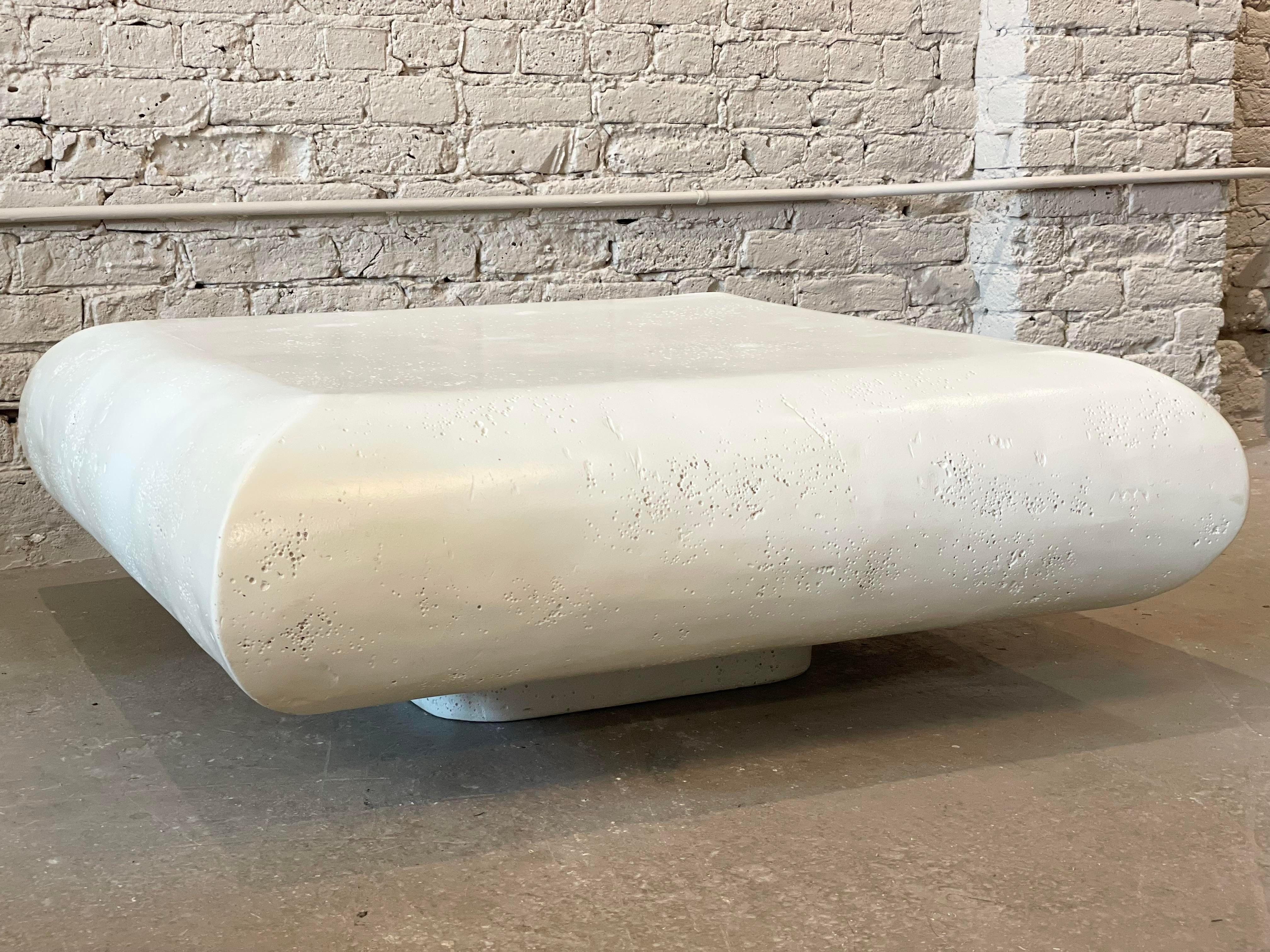Super cool coffee table! Very modern minimal with a space age vibe. Heavy but not too heavy - 2 people can easily move it. It’s also very kid friendly due to the rounded organic edges. Love this!
The color is ivory not pure white.