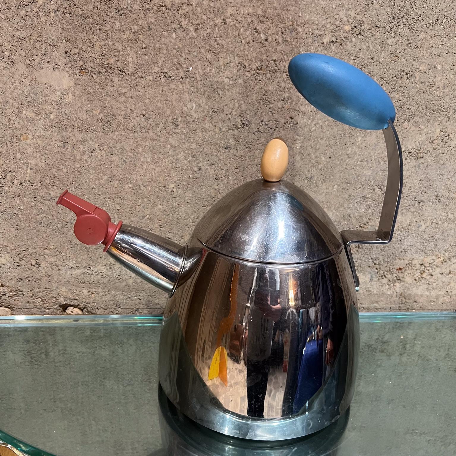 1980s Postmodern Tea Kettle Designed by Michael Graves
With a fun whistle that works when the steam comes out!
12 h x 11.5 long x 7.5 diameter
Preowned unrestored vintage condition. Item is not new.
Refer to all images provided.

