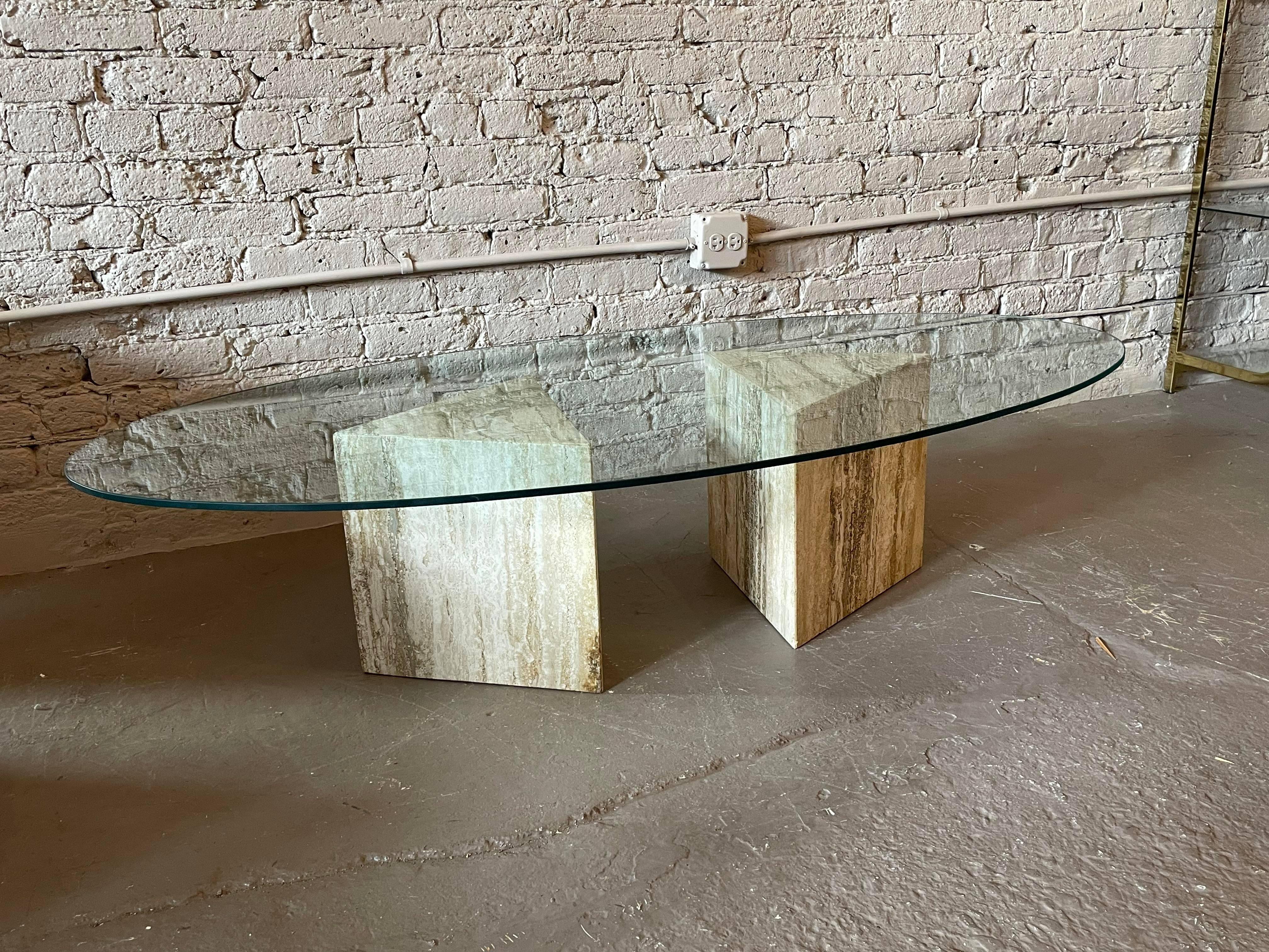 Gorgeous and simple coffee table. Hallow triangle bases with a floating glass oval top. Made in Italy.

Dimensions: 60