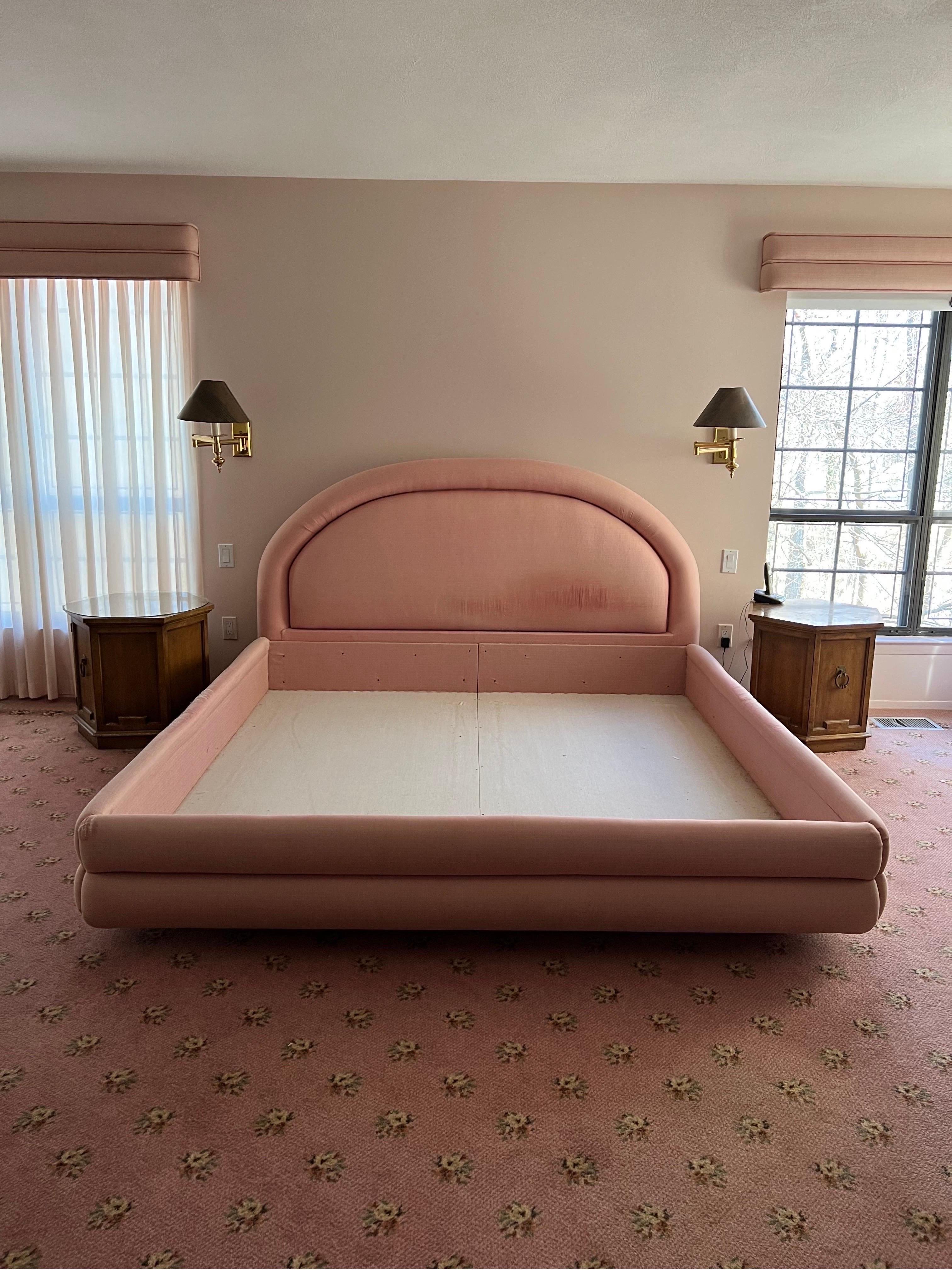 Postmodern upholstery fabric pink king platform bed frame, custom made in 1980

Can use a reupholster but the bone and the frame are solid, very well made.

There is a platform underneath which makes the bed look like it is floating.

On the