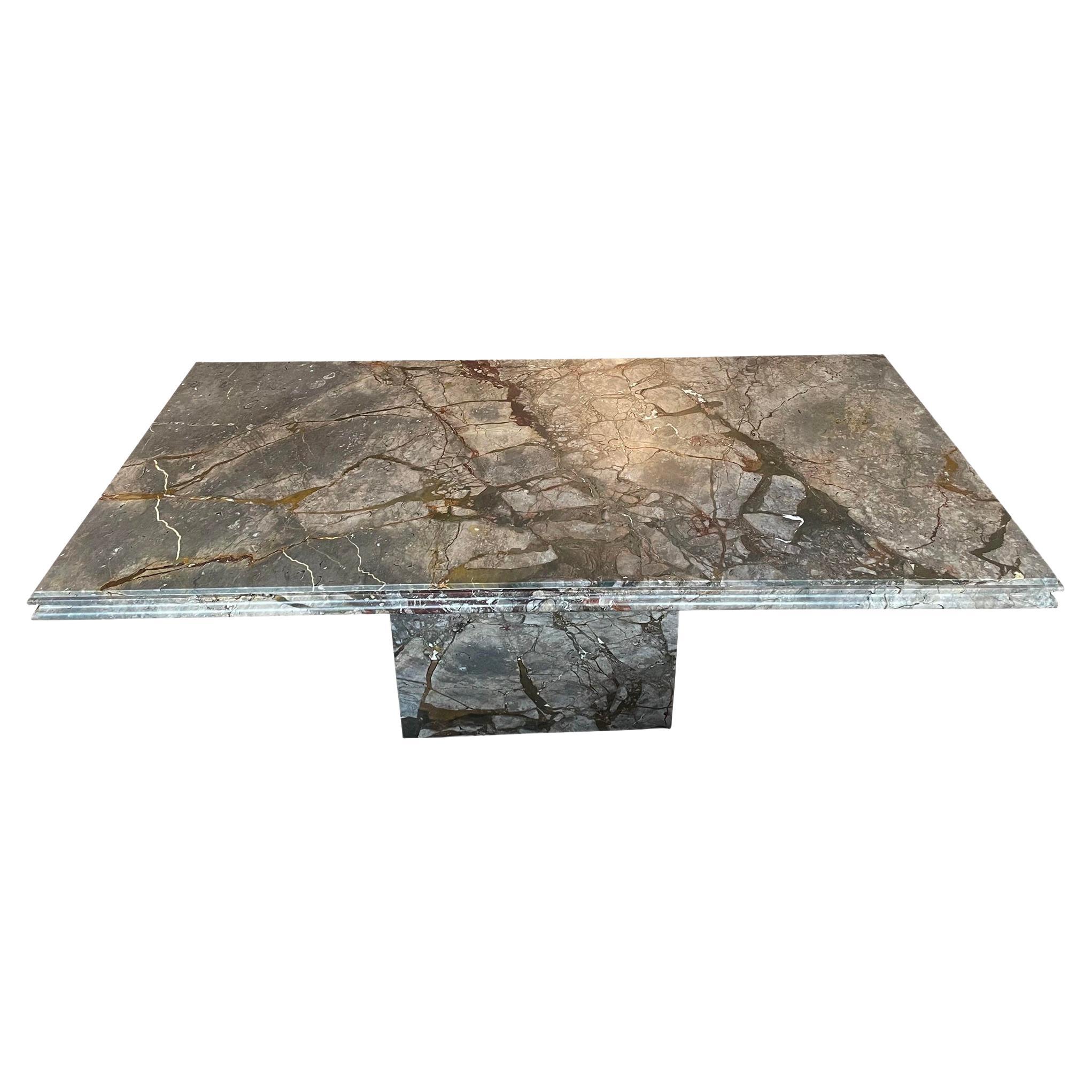 Absolutely stunning dining table in Emperado Marble. I’ve never seen a slab like this! It was lacquered - which was professionally removed so now it’s an organic honed finish which i love. The base also has dramatic veining on one