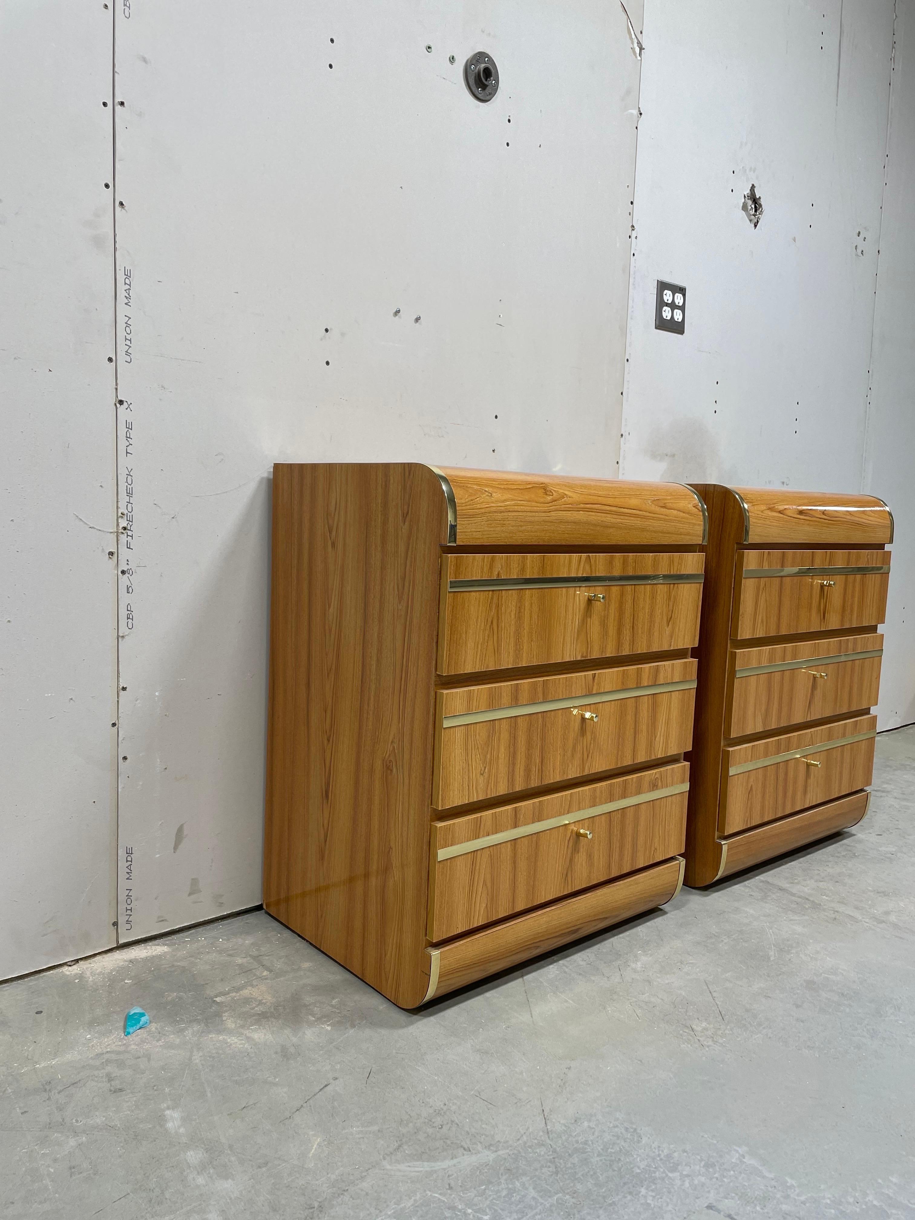 Beautiful waterfall nightstands. Nicely grained veneer laminate with brass trim and drawer pulls. 3 Drawer design for ample storage. 
Curbside delivery up to 75 miles from 07711 - $300.