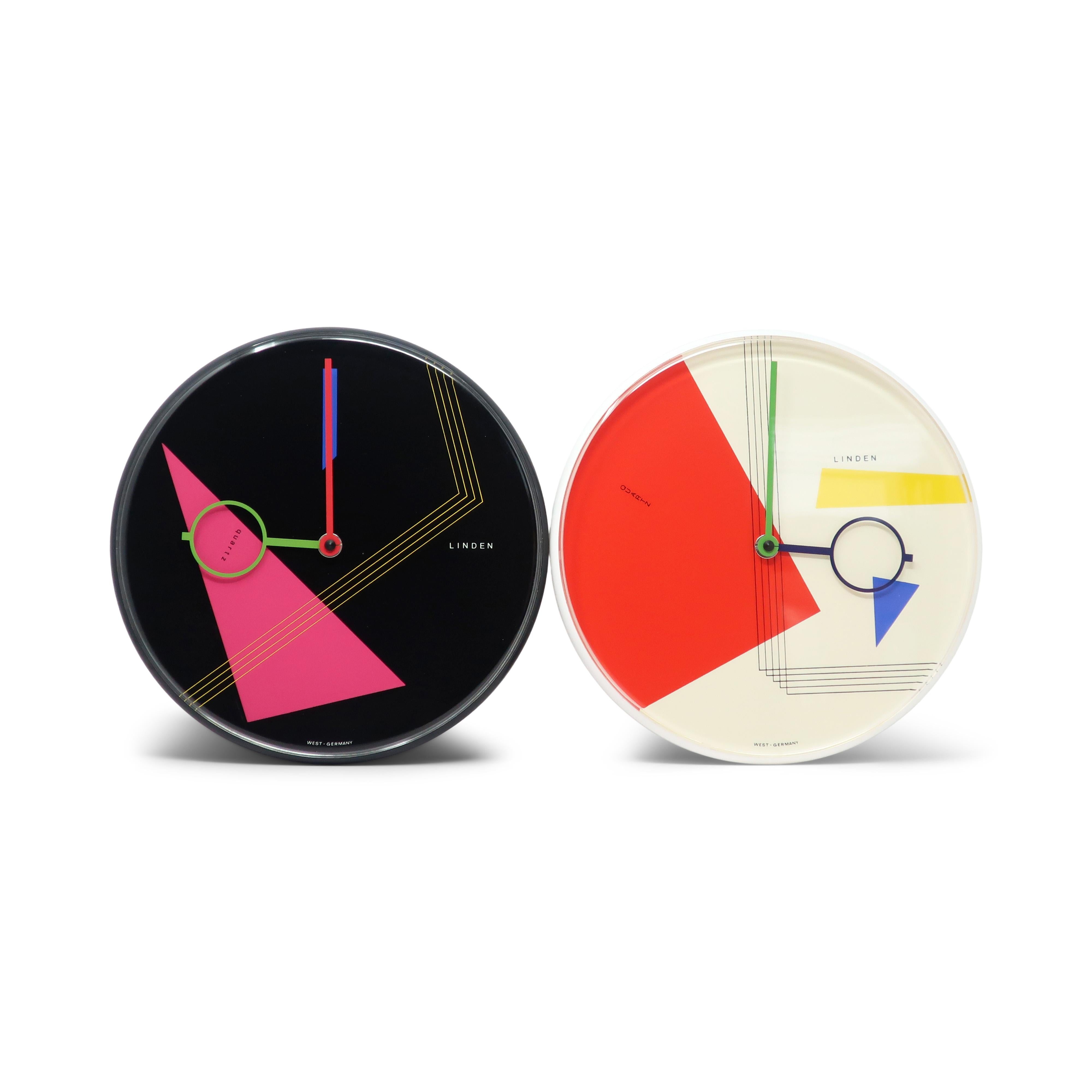 A beautiful postmodern wall clock from the 1980s by West German clockmaker Linden.  It has a white case, white face with geometric accents, and black and green hands,  Striking contrast and fantastic pop of colors with blue, red, black and yellow