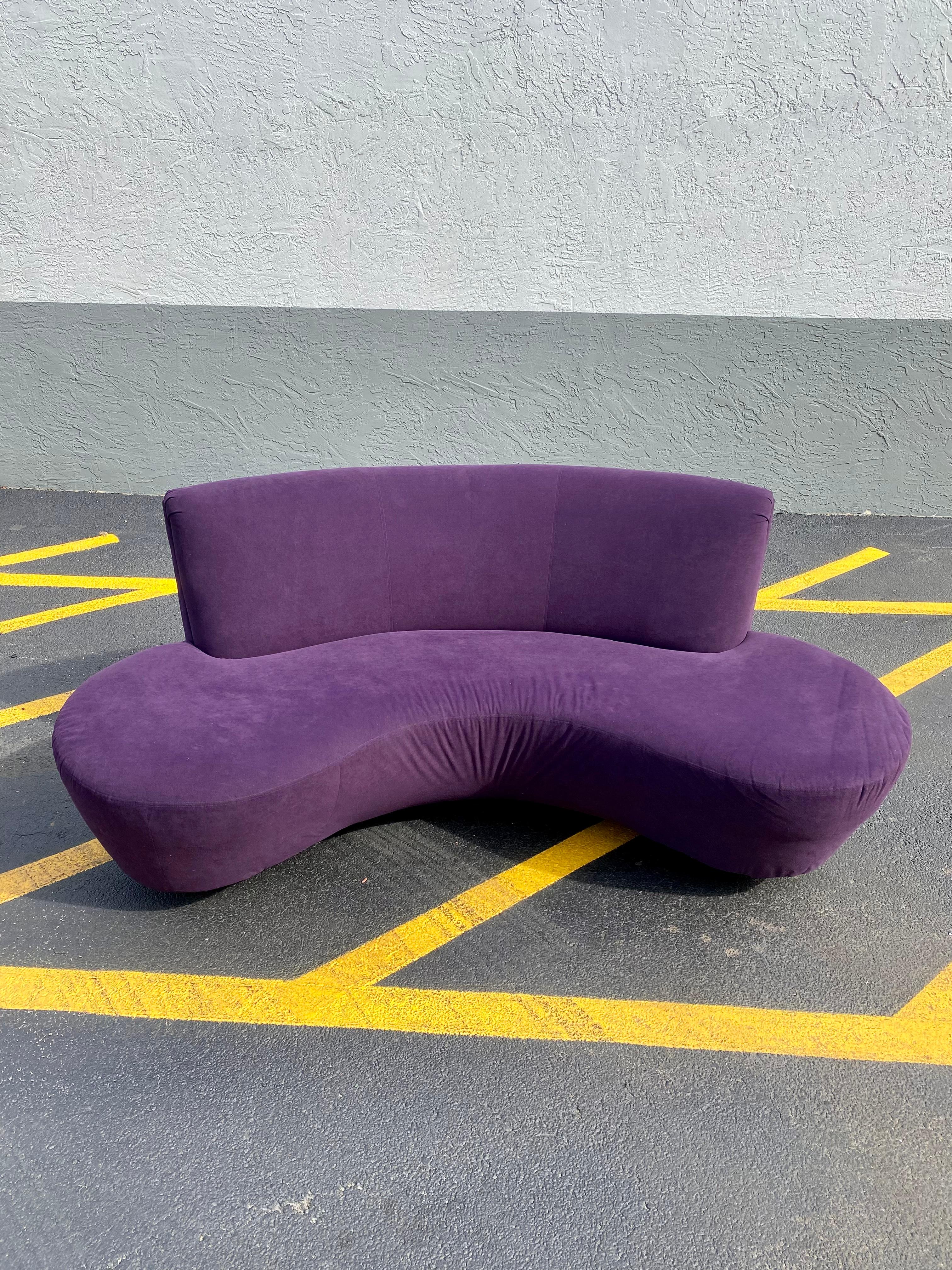 purple curved sofa