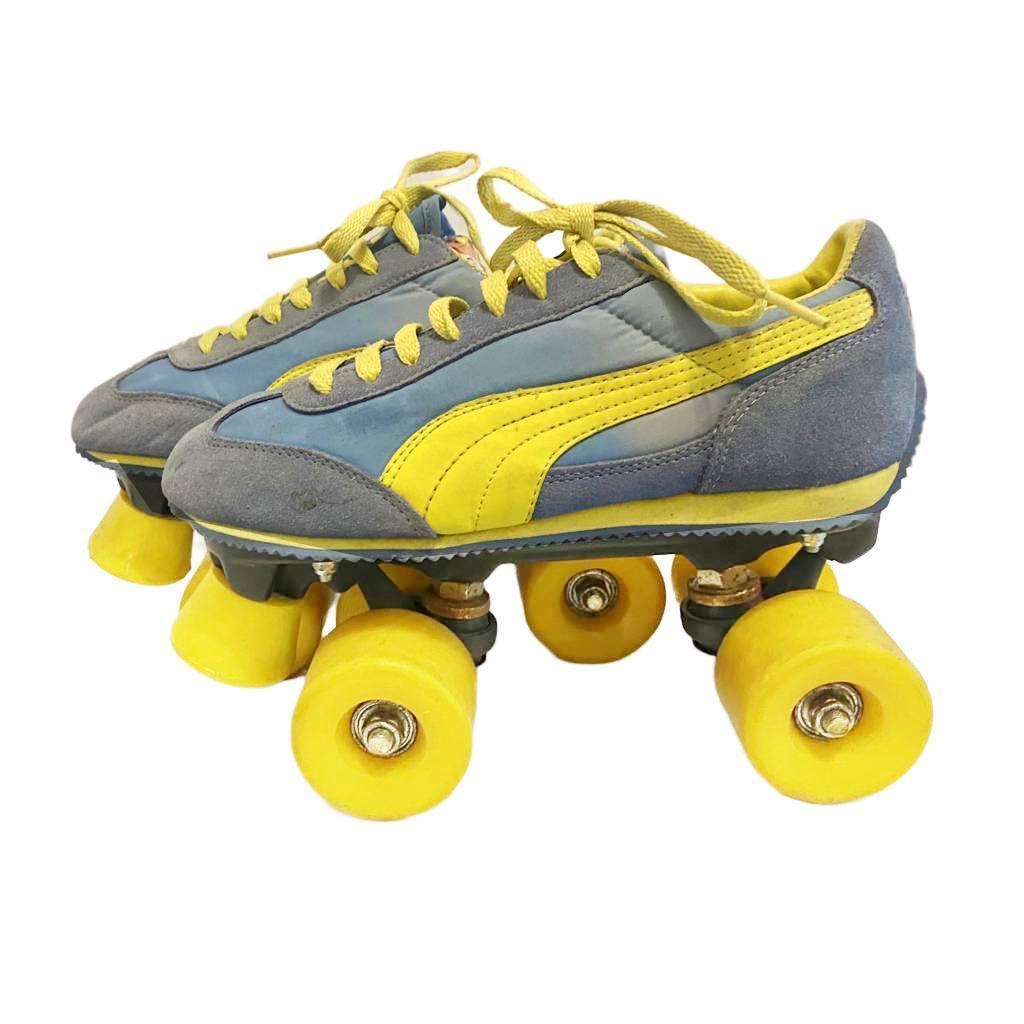 1980s Puma Roller Skates UK size 4 - a sky of blue suede and the famed yellow leather stripe, complemented by gleaming yellow wheels! The perfect vintage décor for the nostalgic!

Size:
37 IT
4 UK
FR 38
JP 24
US 7
Condition: 1980s, vintage. they