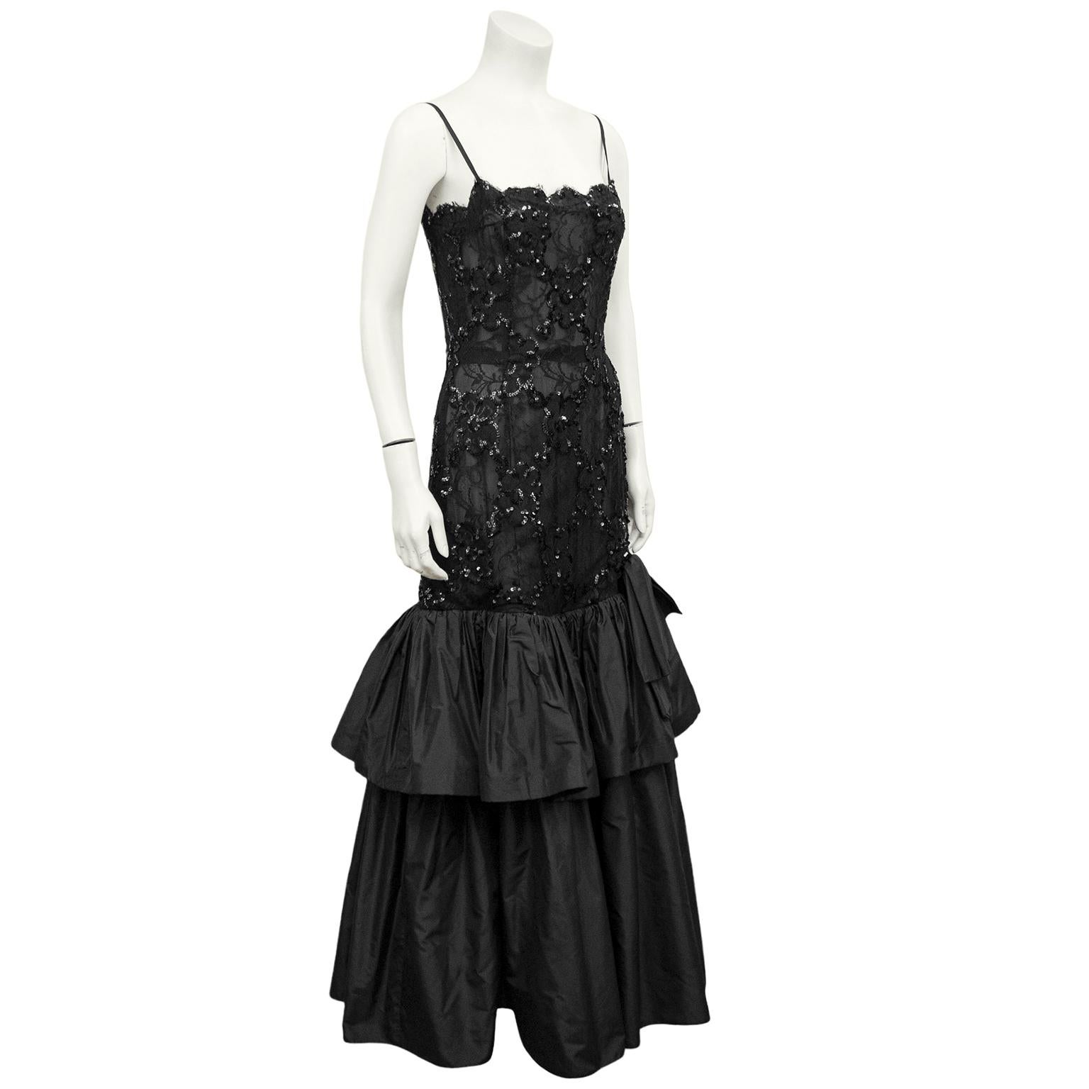 1980s Raffaella Curiel evening gown. Semi-sheer black lace drop waist bodice, embellished with sequins. Tiered black silk taffeta skirt with bow detail. Invisible zipper closure up centre back. Excellent vintage condition. Marked IT 44, fits like a