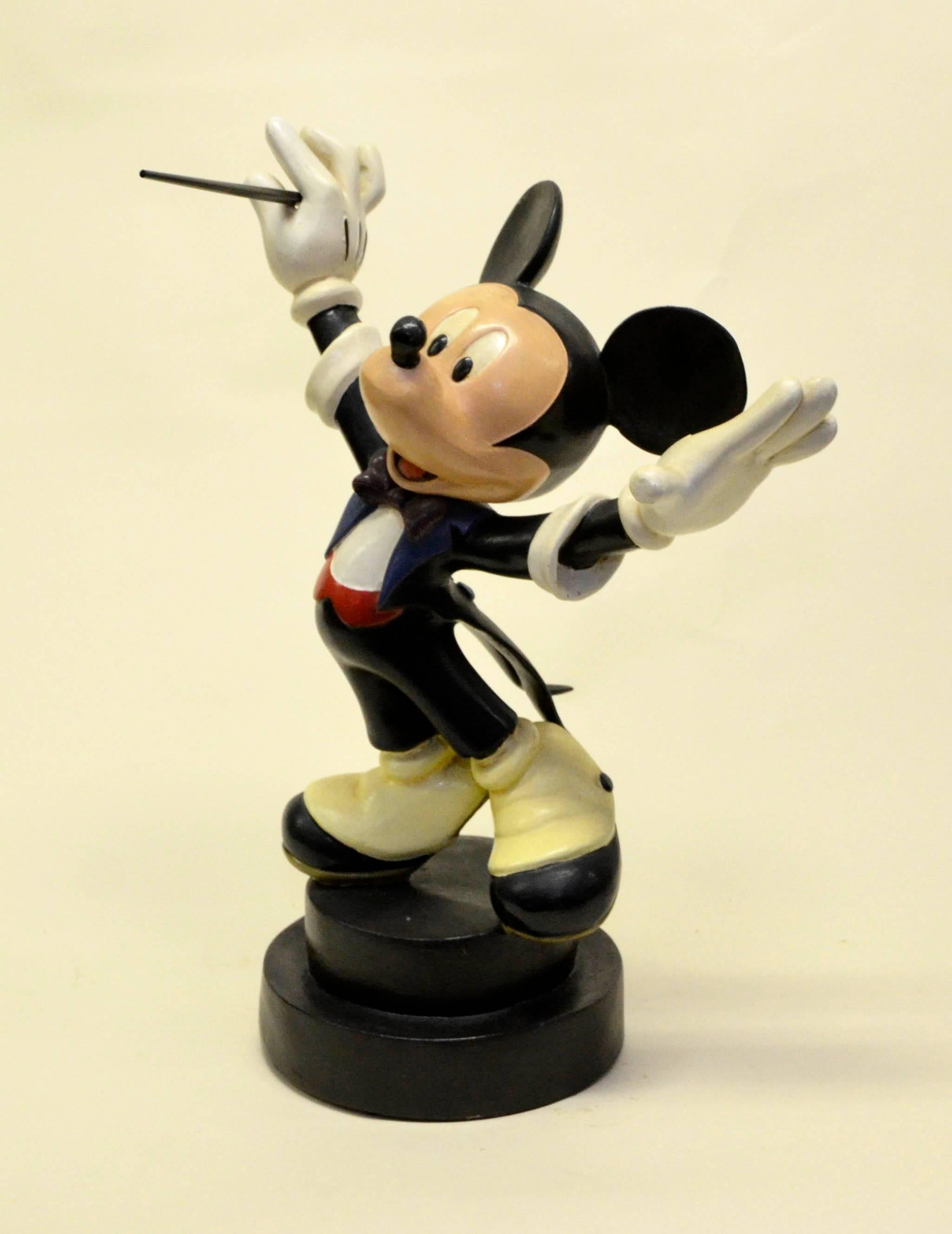Rare 1980s Walt Disney Mickey Mouse conductor statue in fiberglass. Diameter of the base 22cm.

Conductor's baton is not original but otherwise the statue is in excellent conditions.
 