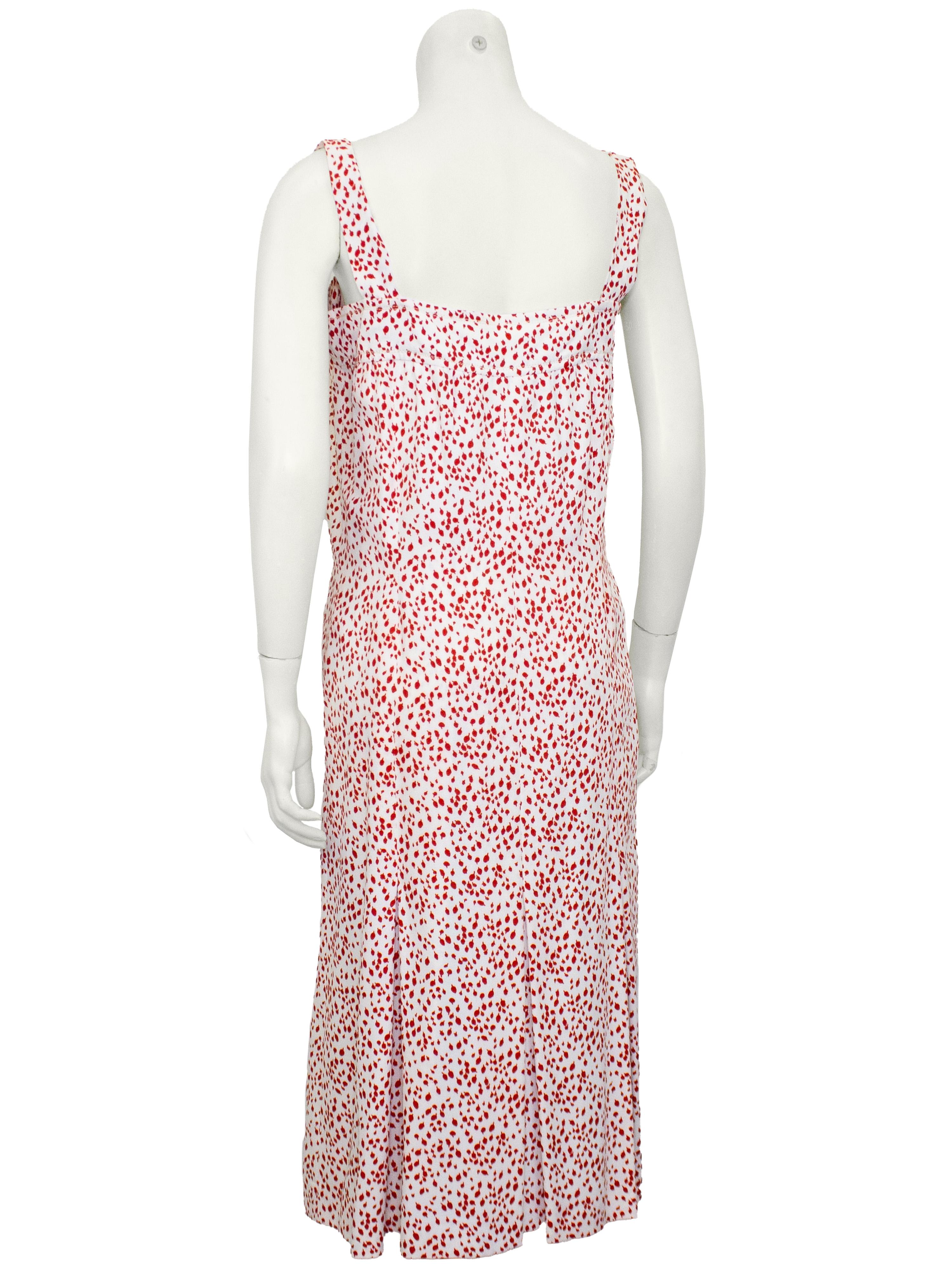 This La Belle Boutique set is a sweet nod to classic 1980s Americana style. Featuring a lightweight synthetic rayon blend, sleeveless button-front sundress in a red and white abstract polka dot print, it's paired with a coordinating short-sleeve