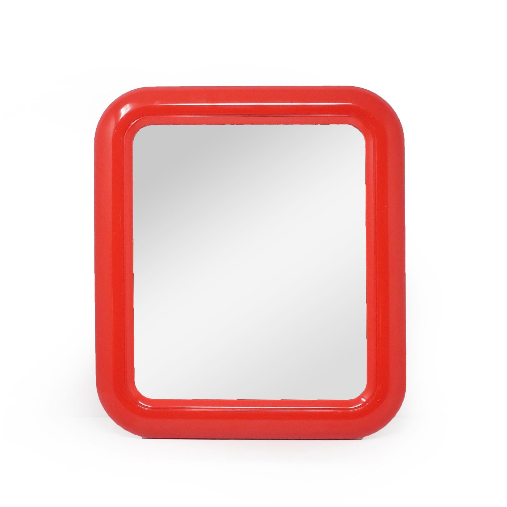 A very cool 1980s modern rectangular mirror in a red plastic frame with rounded corners.  Looks great and adds a pop of color in an entryway, hallway or bedroom, or for decorating a living room.

In very good vintage condition with no silver loss,