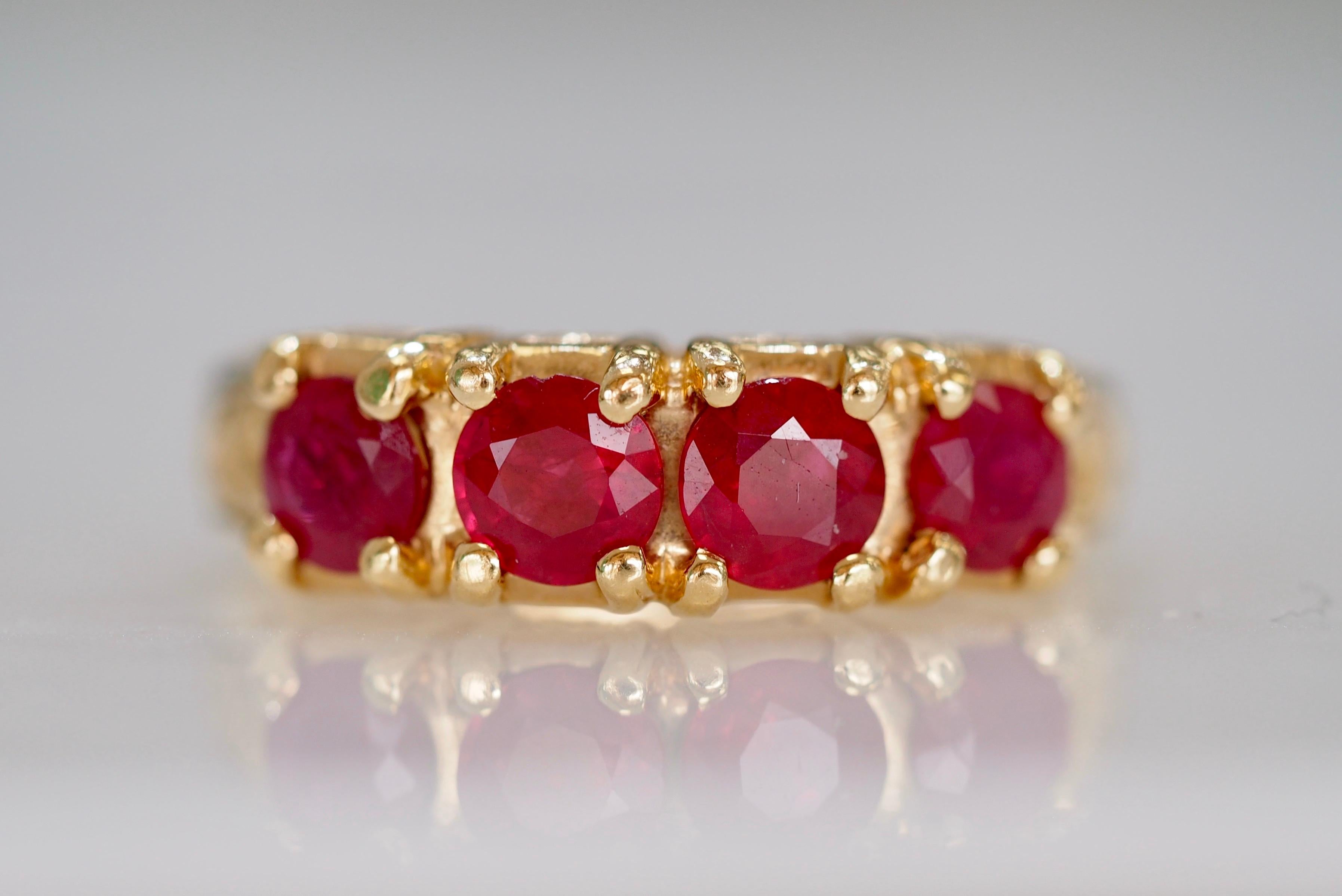 This Retro 1980's ruby band is the perfect every day pop of color. This timeless band can be worn on its own,  as a stackable ring or an engagement band. The band has a substantial weight of 10.4 grams. It has beautiful scroll work engraved down the