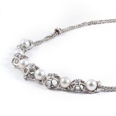 1980s Retro Floral Necklace with Pearls and Diamonds in 18 Karat White Gold