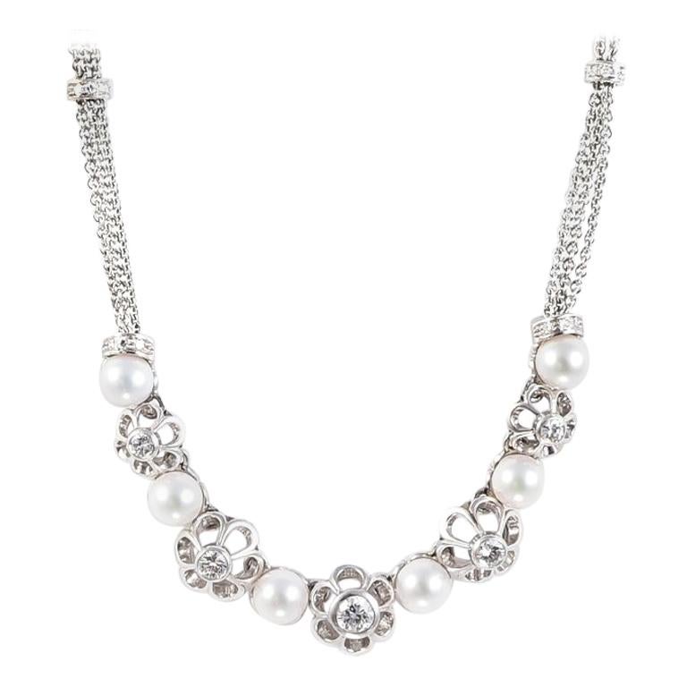 1980s Retro Floral Necklace with Pearls and Diamonds in 18 Karat White Gold For Sale