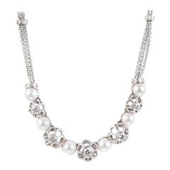 1980s Retro Floral Necklace with Pearls and Diamonds in 18 Karat White Gold