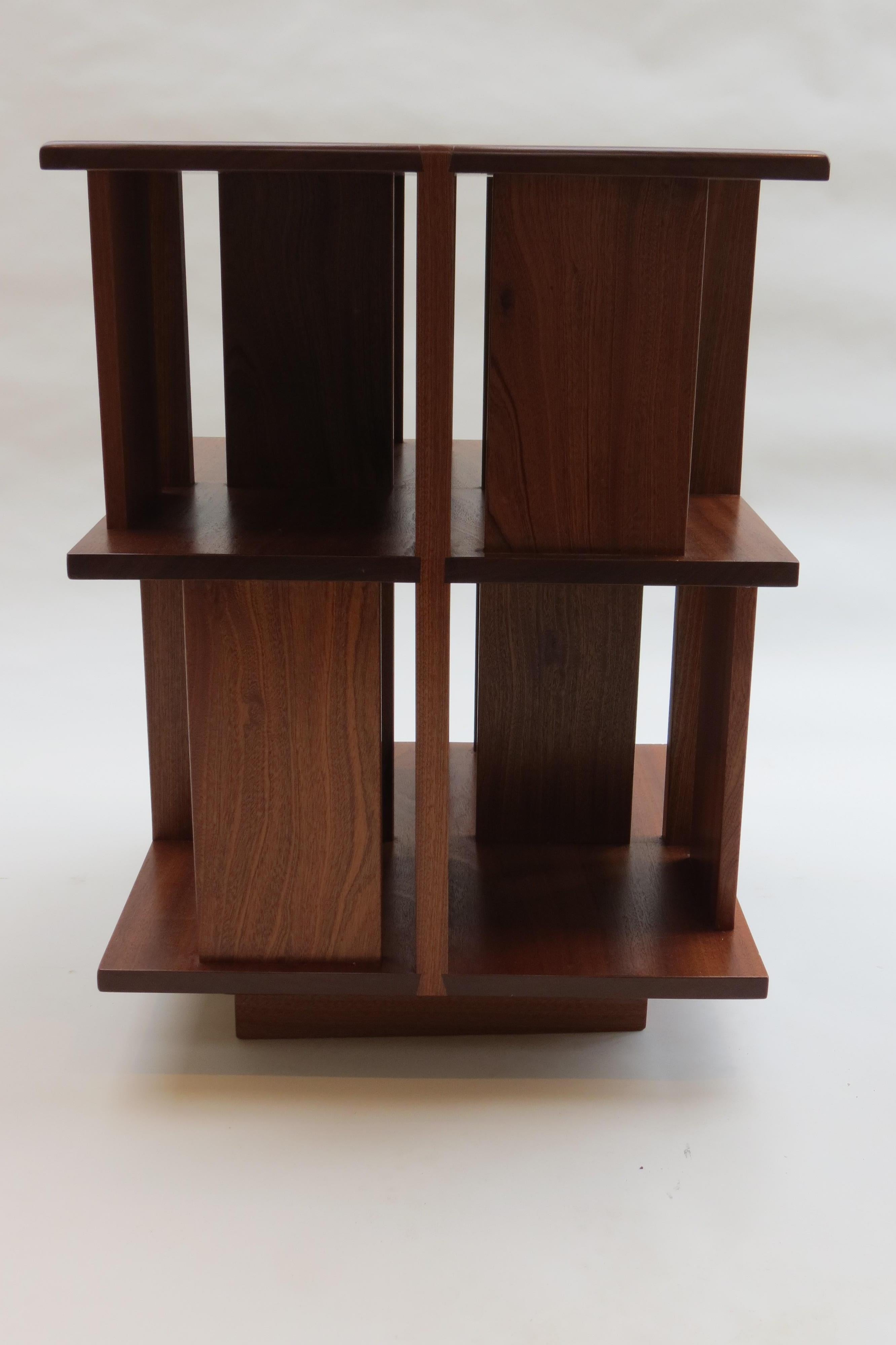 Revolving bookcase made from solid Afrormosia. Excellent condition, dates from 1980s, lovely dovetail detail to the top. Very nice quality, made in the UK.  The 