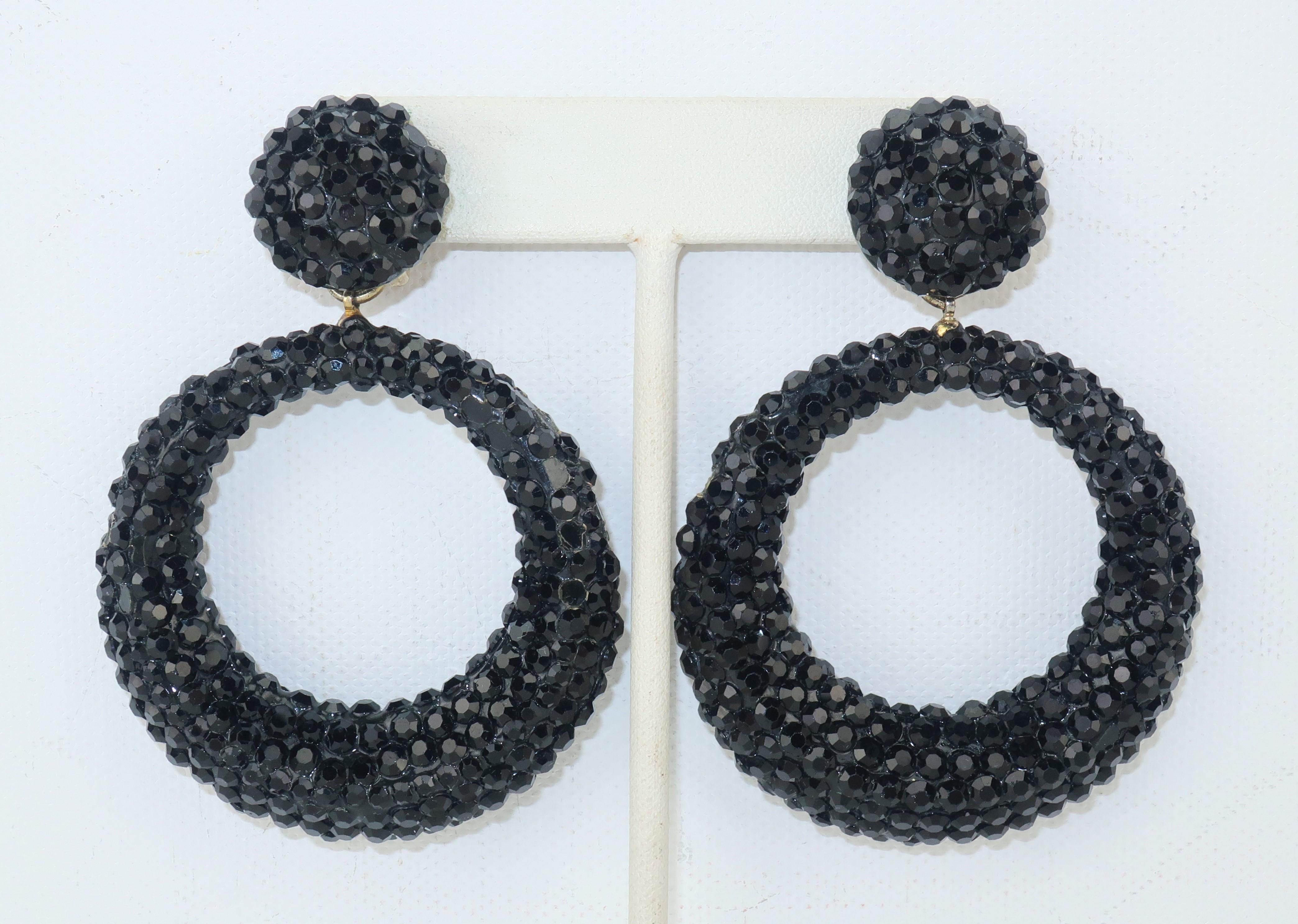 Create a 'hoopla' with Richard Kerr's large black pave crystal hoop earrings!  The clip on base is comfortable enough for all day or evening wear.  Signed with a medallion on the back of each base.  Each earring measure 3