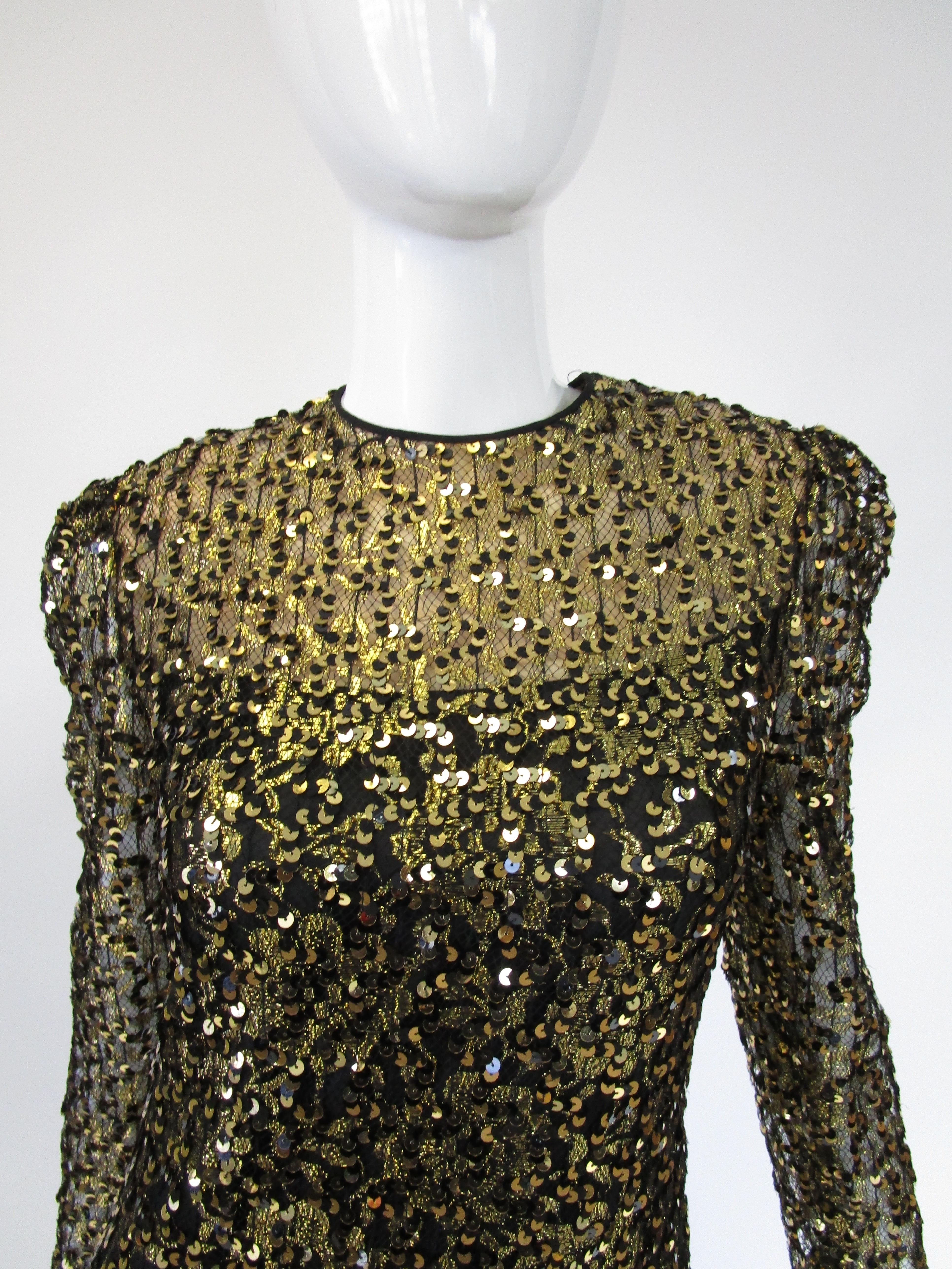
Simply beautiful sequined evening dress by Richilene. This dress features a glimmering body of gold and black sequins that fit snugly around the wearers body, the lower portion of the dress is gusseted with black chiffon that drapes graciously