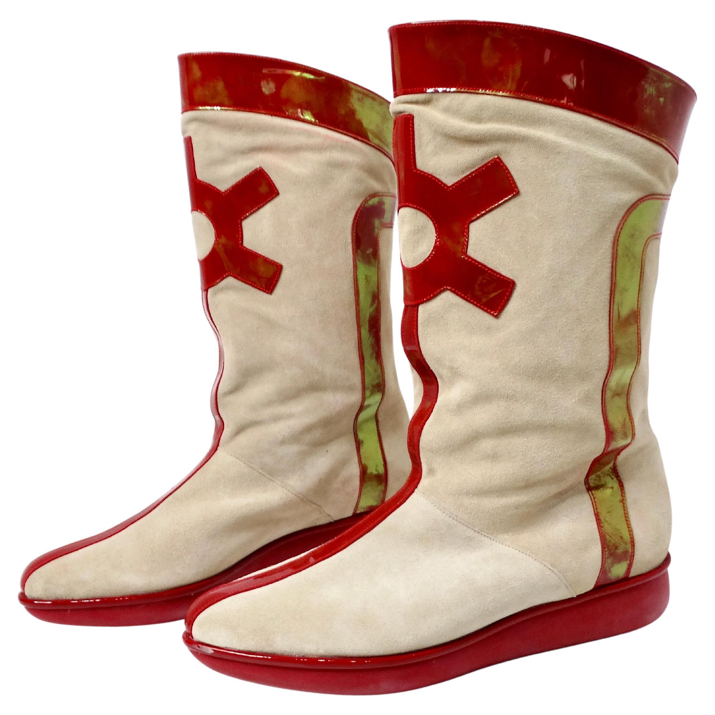 Step back in time with these stunning 1980s Robert Clergerie Suede & Red Patent Leather Iridescent Retro Boots. Crafted from premium tan suede, these boots are beautifully complemented by vibrant red patent leather that features an enchanting