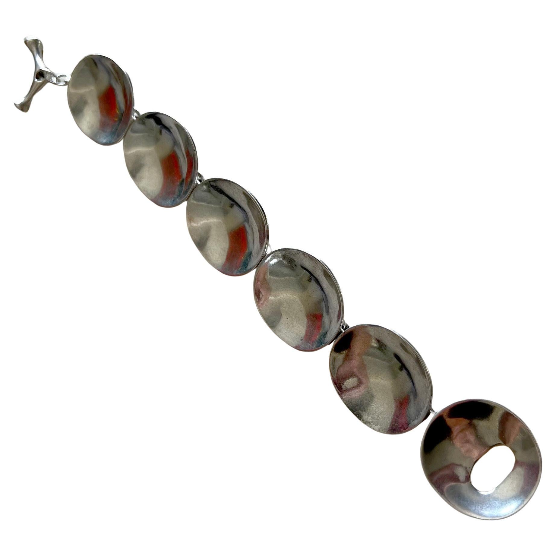 Concave disc bracelet created by Robert Lee Morris of New York City, NY circa 1980s/1990s.  bracelet measures 8.5