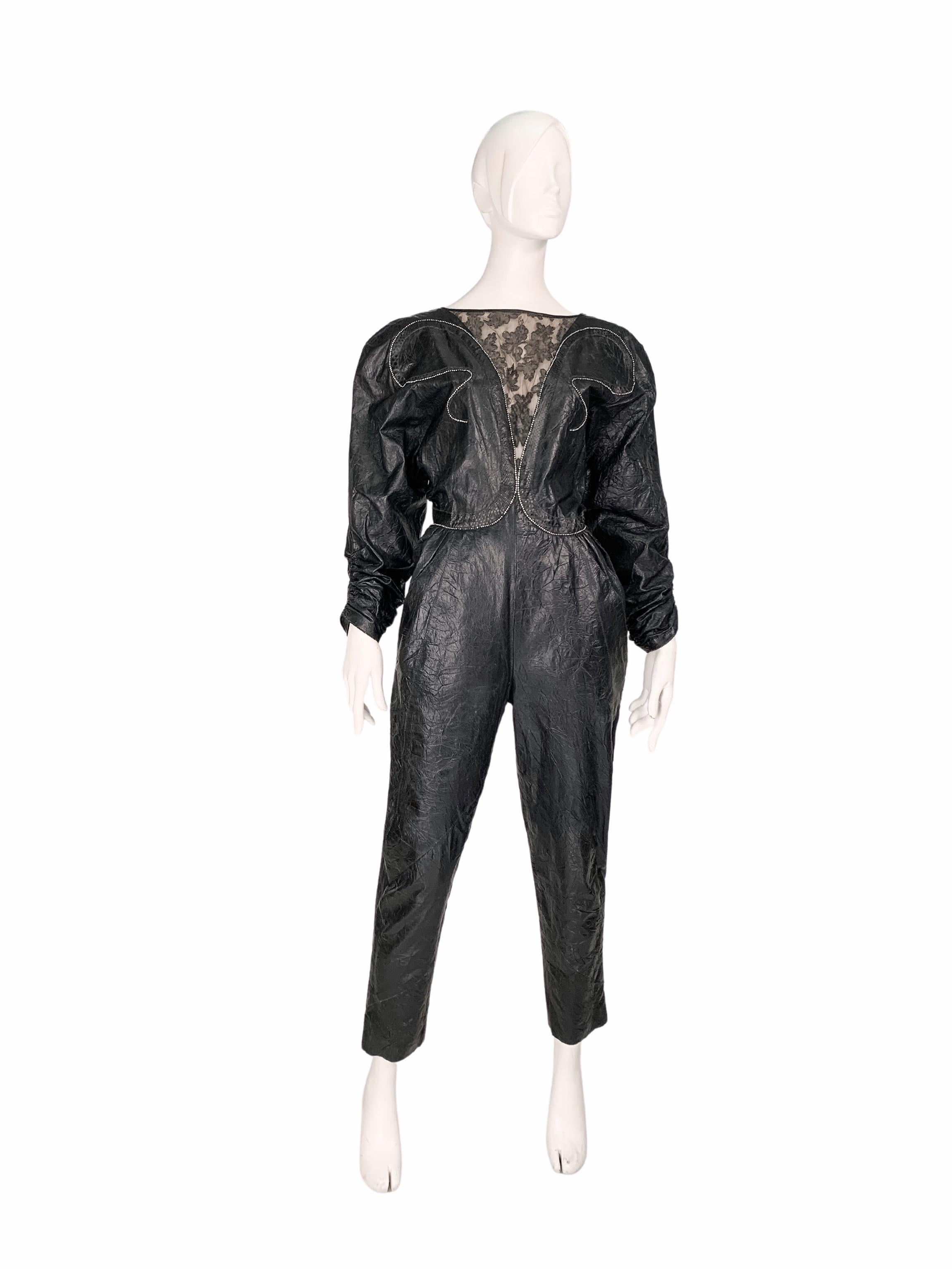 Roberto Cavalli vintage 1980s leather jumpsuit of a dramatic hourglass silhouette, with a low-cut back and sleek rhinestone embellishments. Fashioned in lightweight fine leather with a particular wrinkle-effect finish. Features a lace insert and a