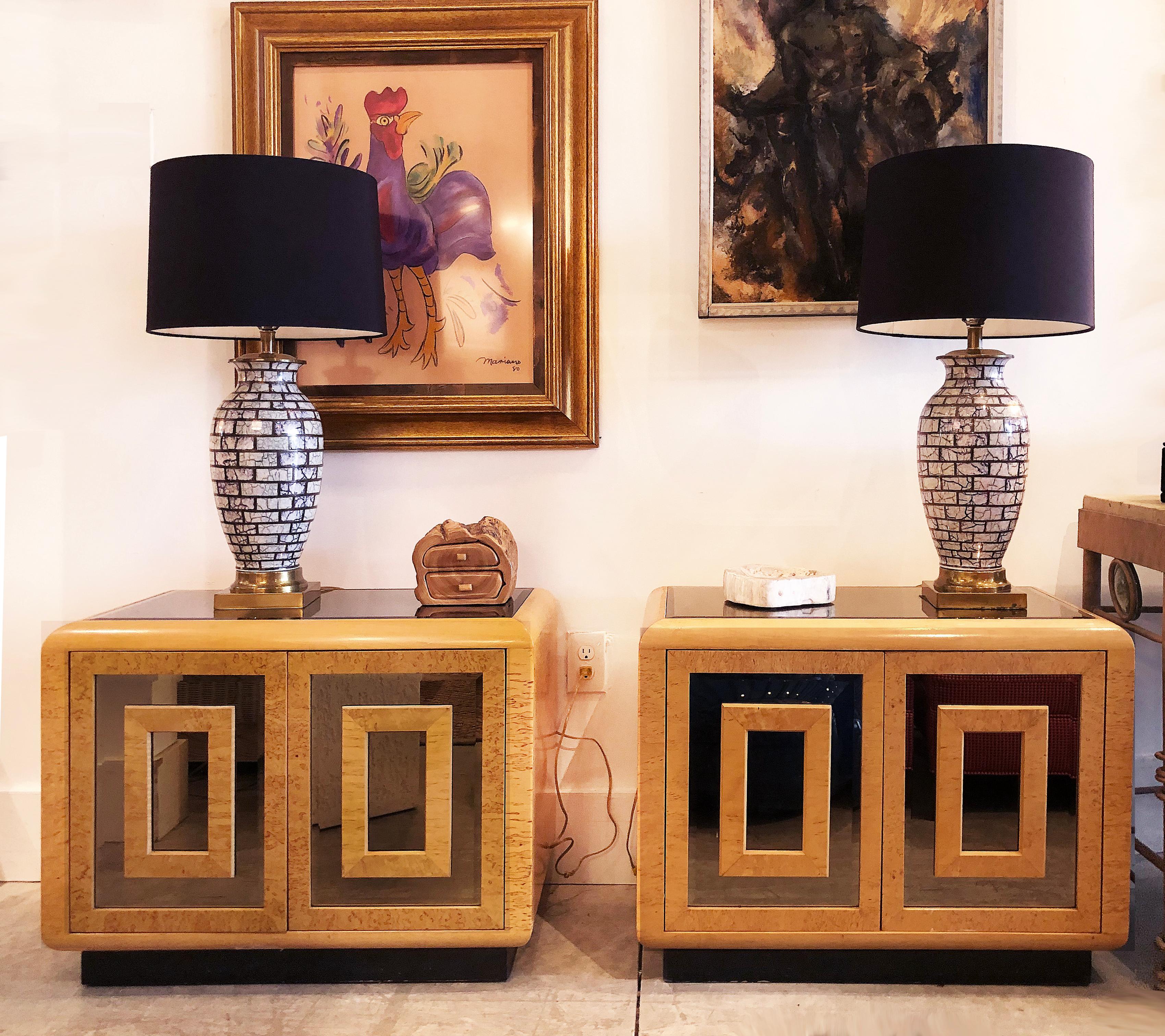 1980s RomWeber patterened maple mirror nightstands

Offered is a substantial pair of 1980s modern RomWeber Furniture Nightstands created with great patterned matched maple veneers with smoked beveled mirror doors and inset smoked mirrored tops. Each