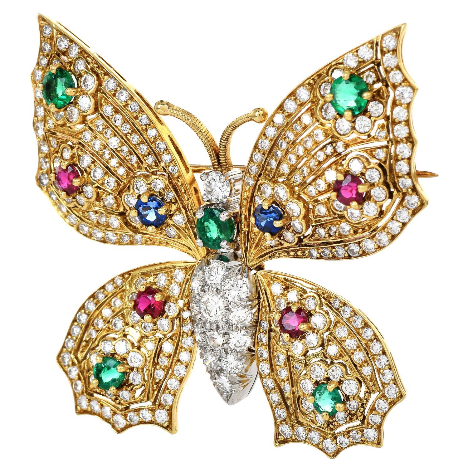 A display of color with vivid Blue, Red, and Green, enhanced by the sternal sparkle of the Diamonds, this beautiful butterfly brooch is perfect to wear with your favorite scarf.

This beautiful brooch is crafted in solid 18K yellow gold & center