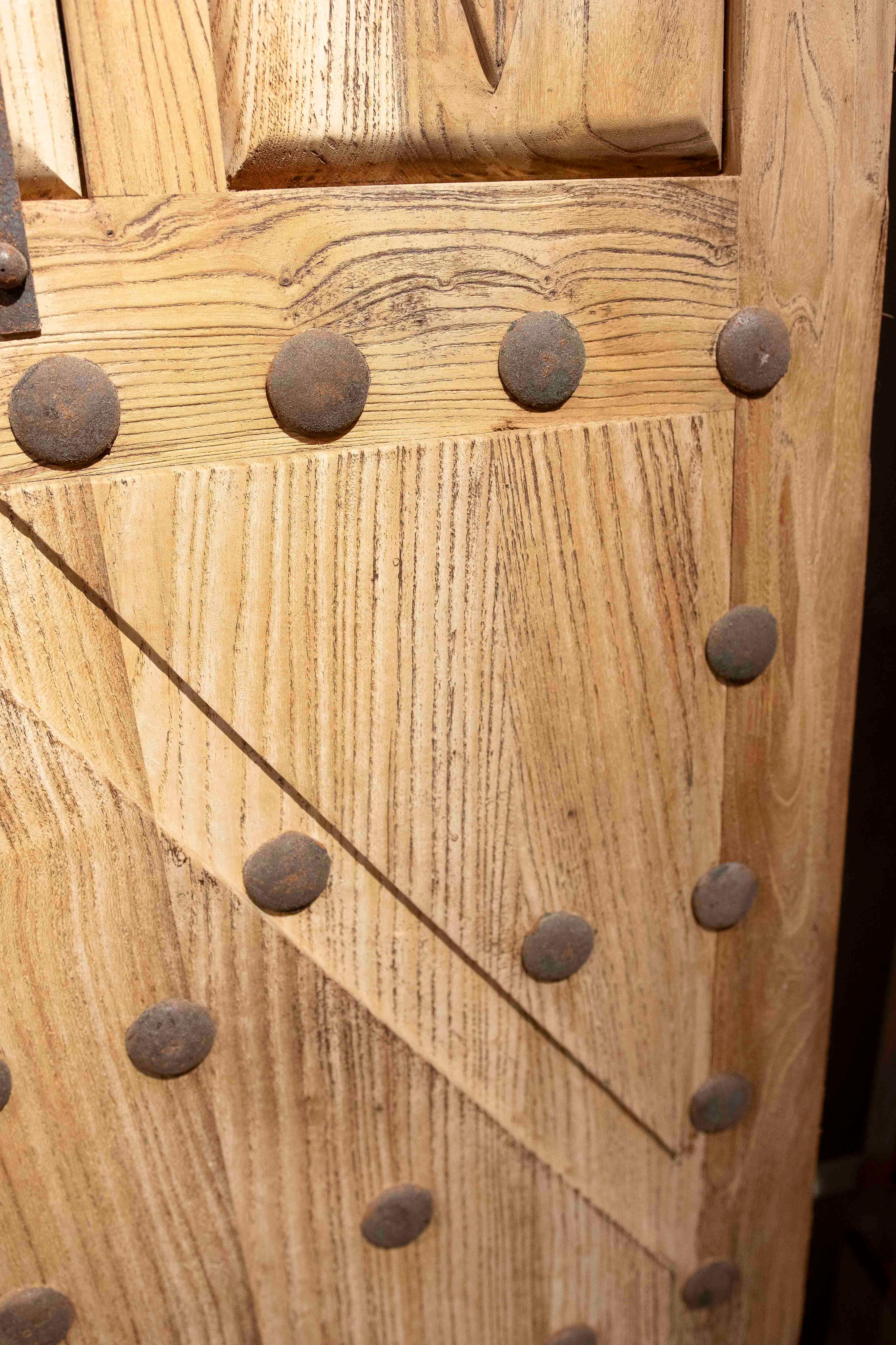 Iron 1980s Rustic Elm Wood Door with Nails and Decorative Grille For Sale