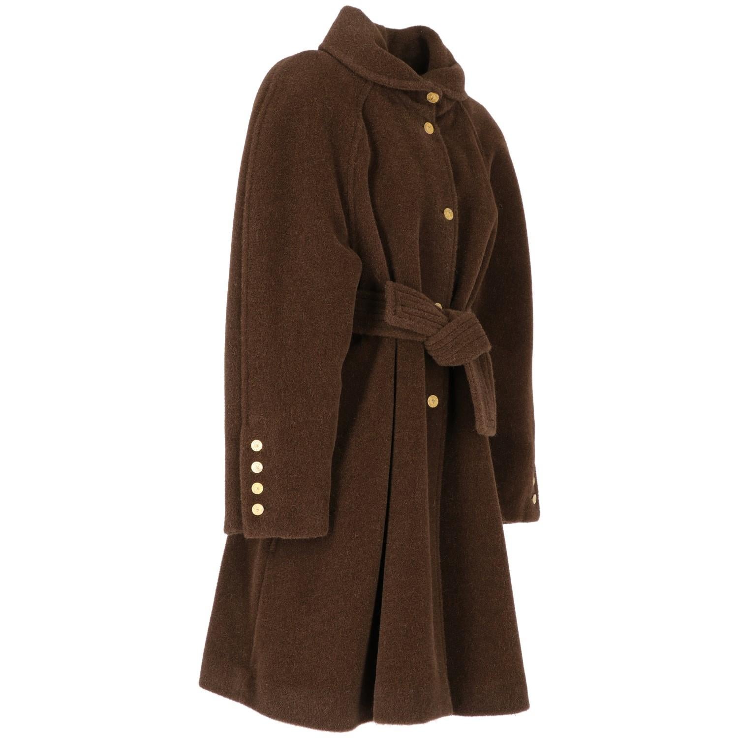 The Sonia Rykiel brown alpaca wool classic collar coat features raglan sleeves, front fastening and cuffs with branded gold tone metal buttons, side pockets and waist belt. This coat is in perfect conditions.

Years: 1980s

Made in France

Size: