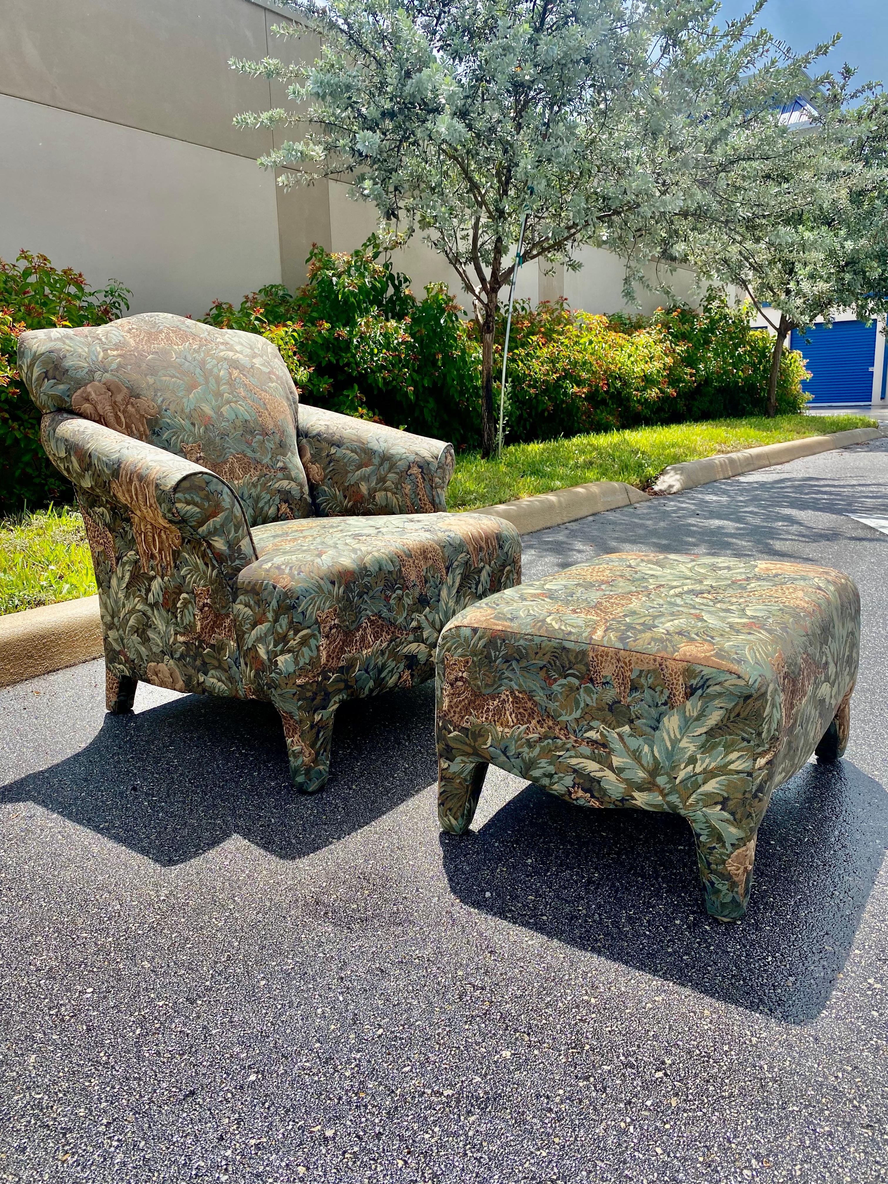 This extremely rare chair and ottoman set is packed with personality! Outstanding design is exhibited throughout. You rarely see this popular chair style with a matching ottoman, much less in this customized stunning safari tapestry. Fully