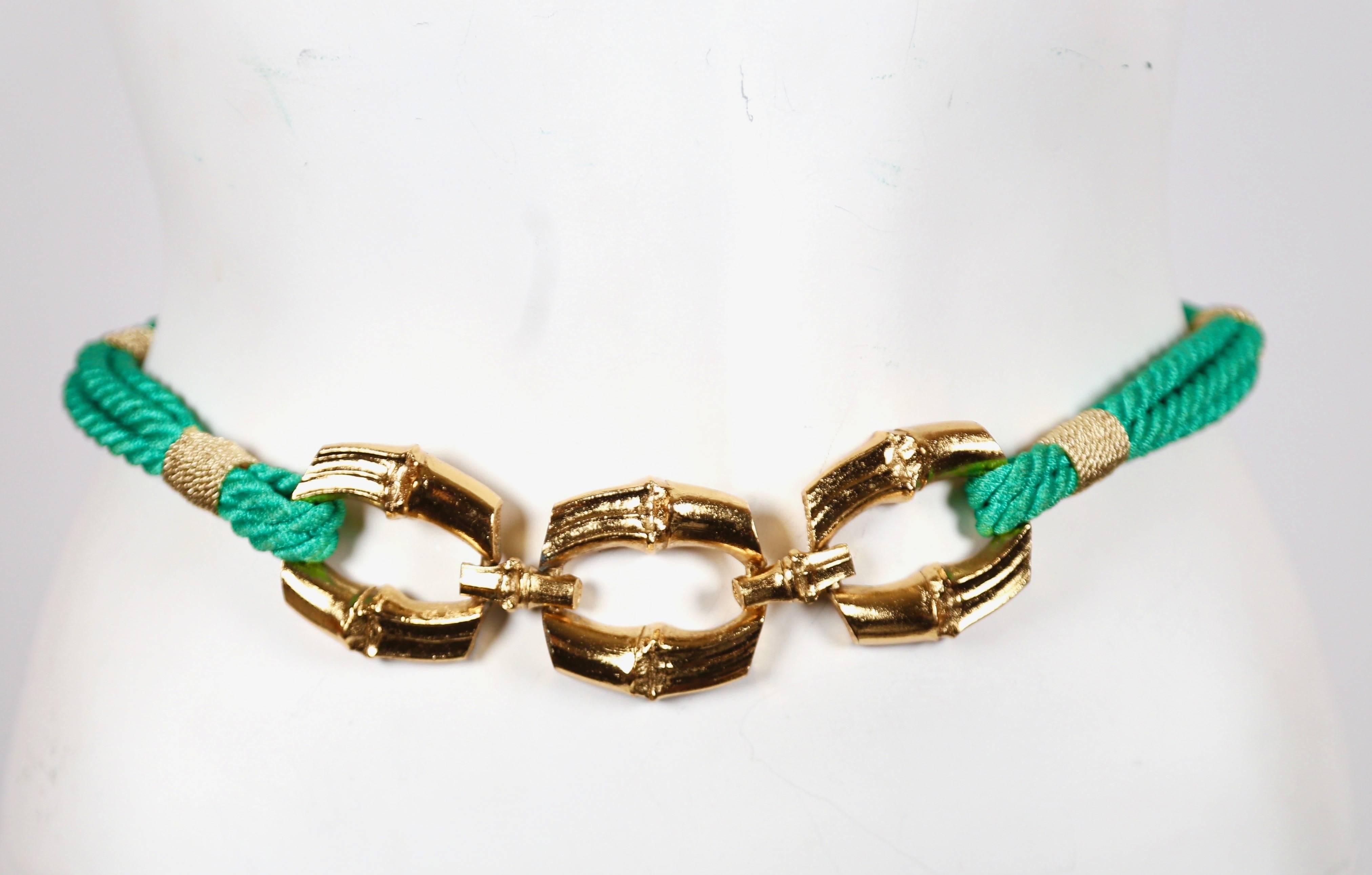 Vivid green, woven cord belt with gilt bamboo buckle designed by Yves Saint Laurent dating to the 1980's. Belt is not stamped however authenticity is guaranteed. Color is more vivid in person. Approximate length 26.5-27