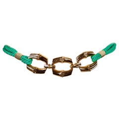 SAINT LAURENT Ceinture en cordon tissé vert avec boucle en bambou doré, années 1980