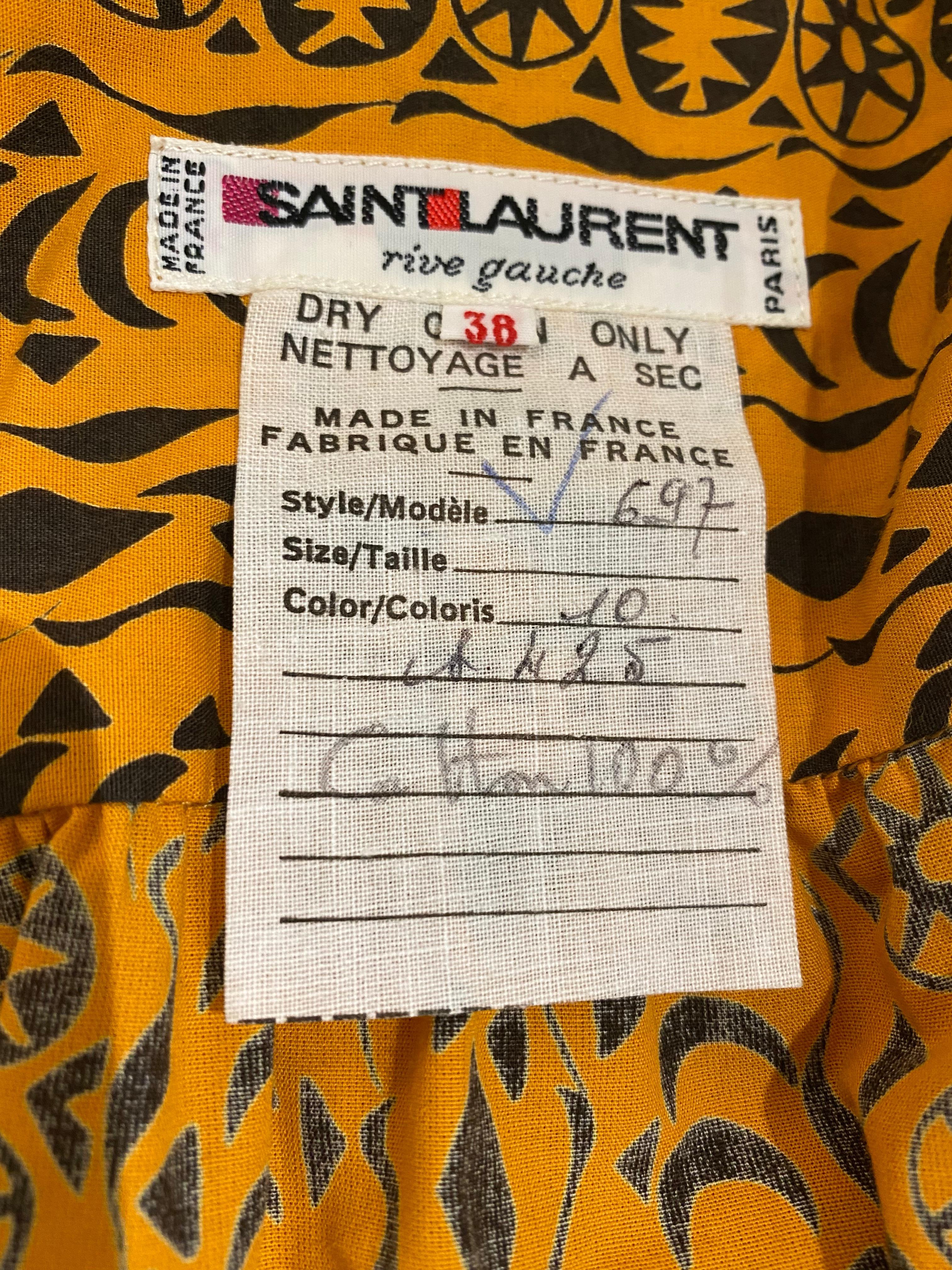1980s Yves Saint Laurent rive gauche orange and black african print cotton blouse and pant sets.
Size: Small -Med 
 top measurement : B:48”/ W:48”/ Hip:48”/ Sleeve: 22” 
Pants measurement : elastic waist 26” stretch up 30” / Hip: 40” / Pants length: