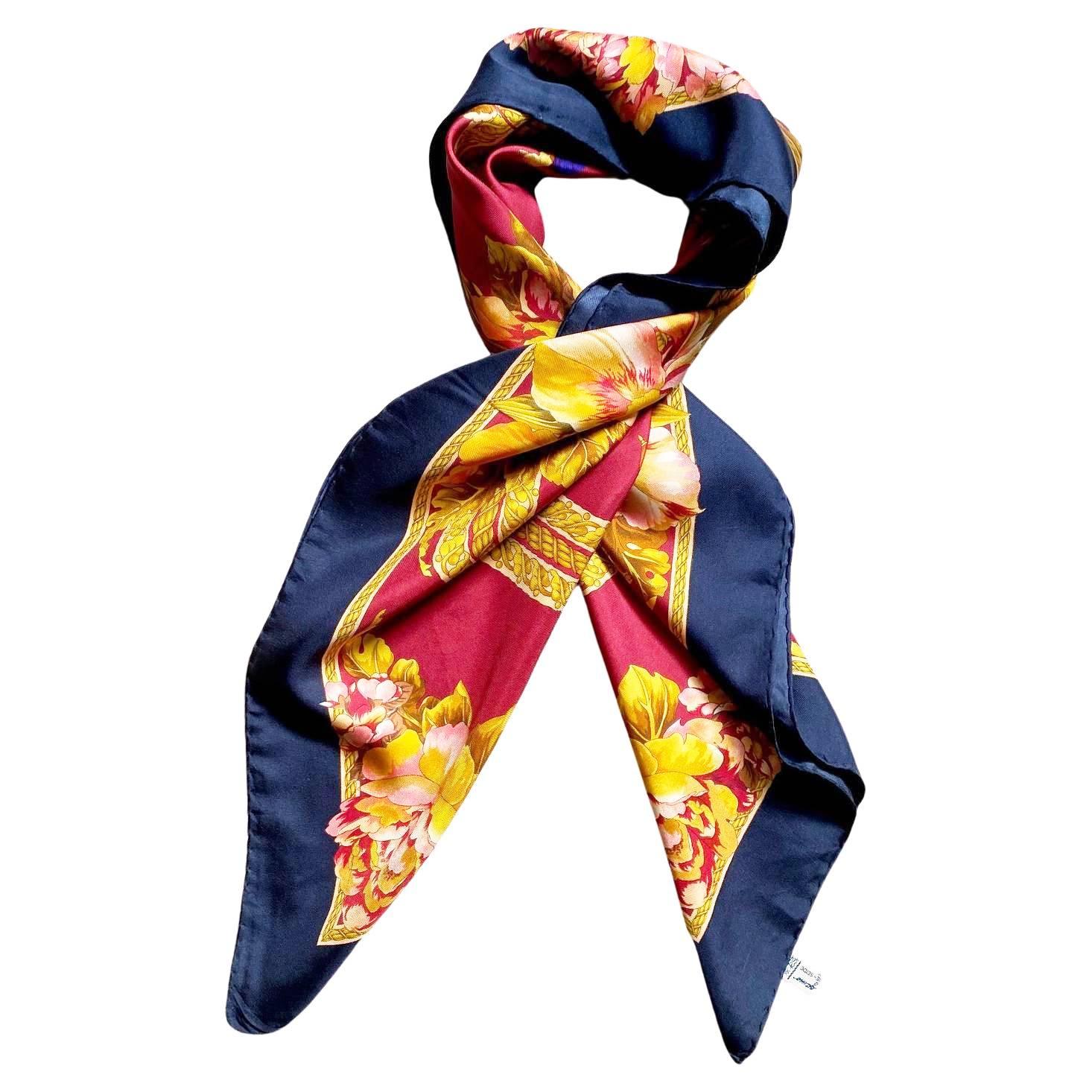 This 1980s Salvatore Ferragamo luxurious silk babushka scarf is the perfect piece to make a statement. The classic Chinese Flying Warrior design, rendered in a deep vibrant hue, will instantly elevate any ensemble. Add a touch of timeless